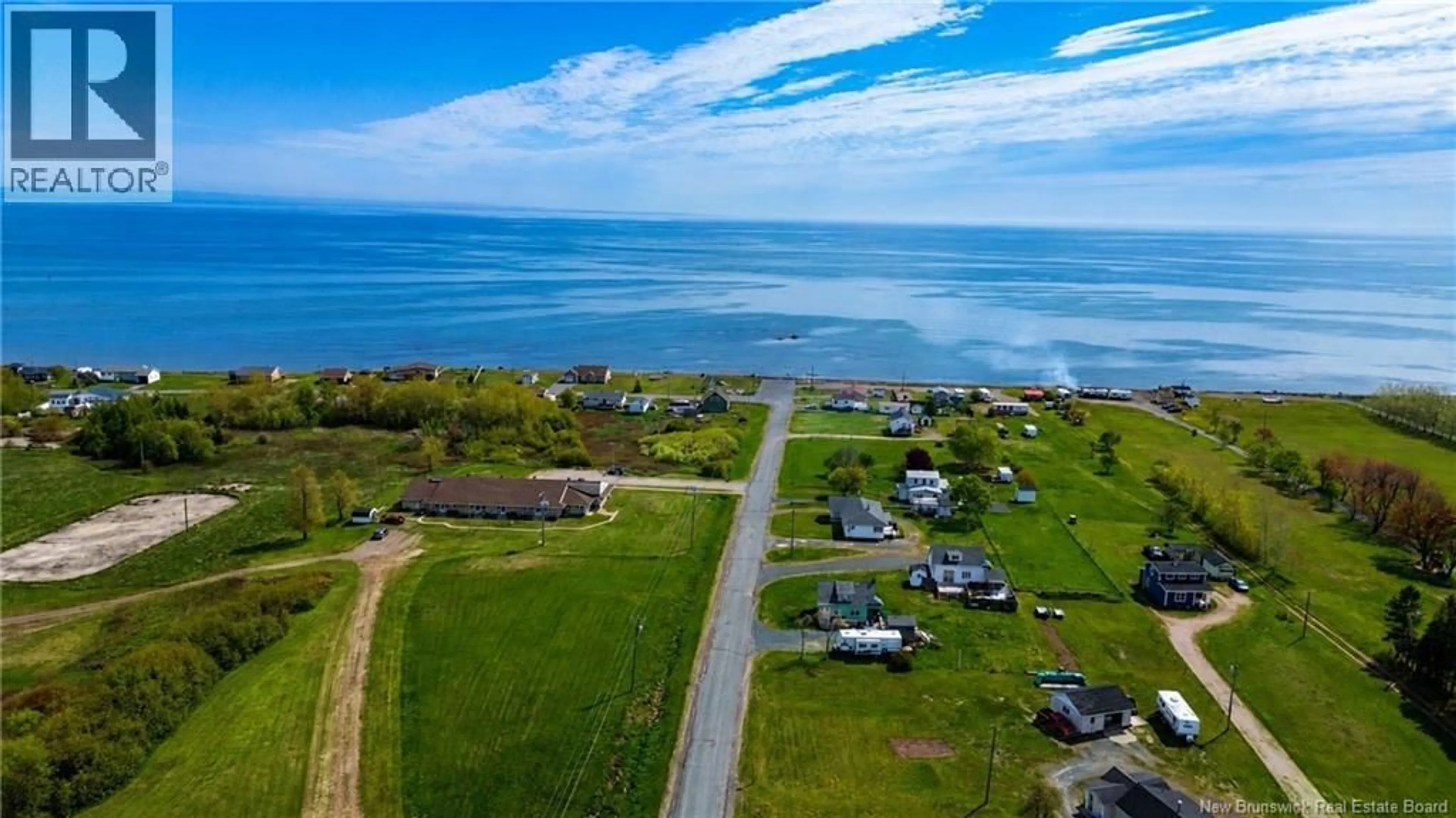 A pic from outside/outdoor area/front of a property/back of a property/a pic from drone, water/lake/river/ocean view for 91 RUE DU PARC OUEST, Pointe-Verte New Brunswick E8J2Y1