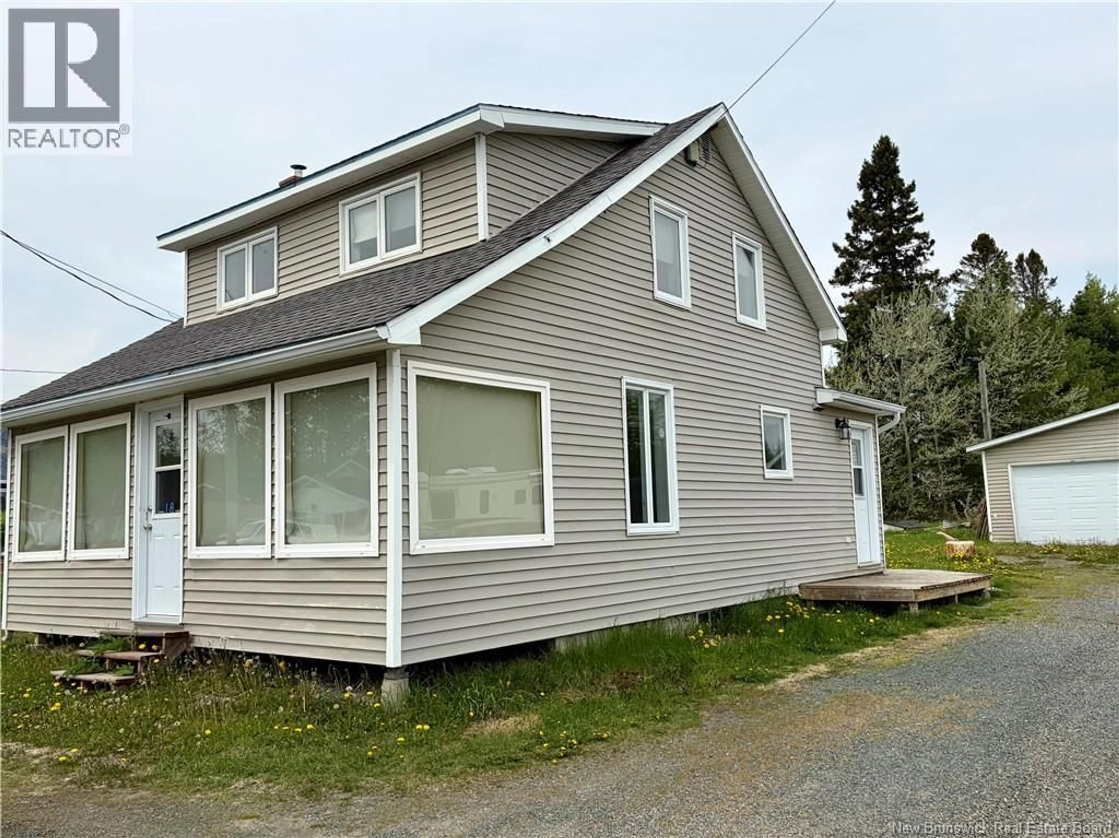 Home with vinyl exterior material, street for 18 MALLET, Eel River Crossing New Brunswick E6E1R9