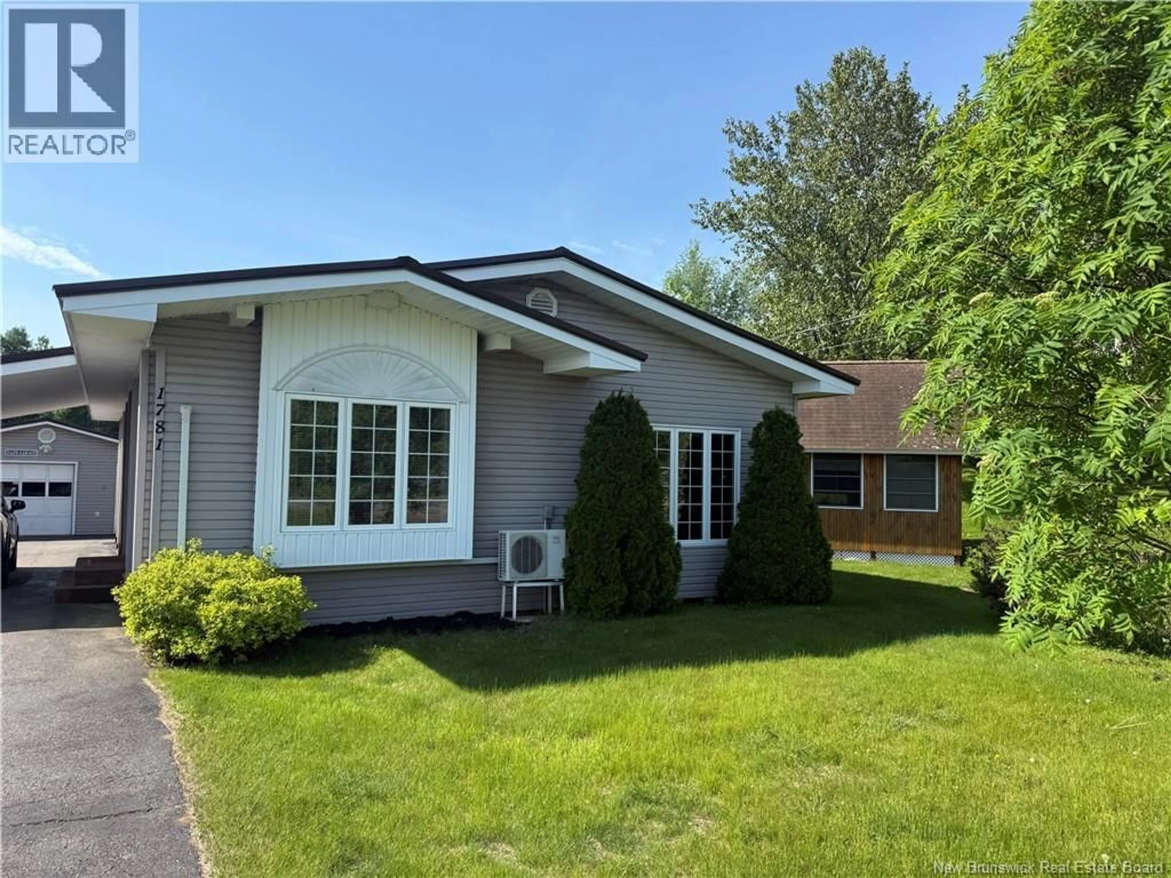 Home with vinyl exterior material, street for 1781 NICHOLAS DENYS, Sainte-Rosette New Brunswick E8K3J9