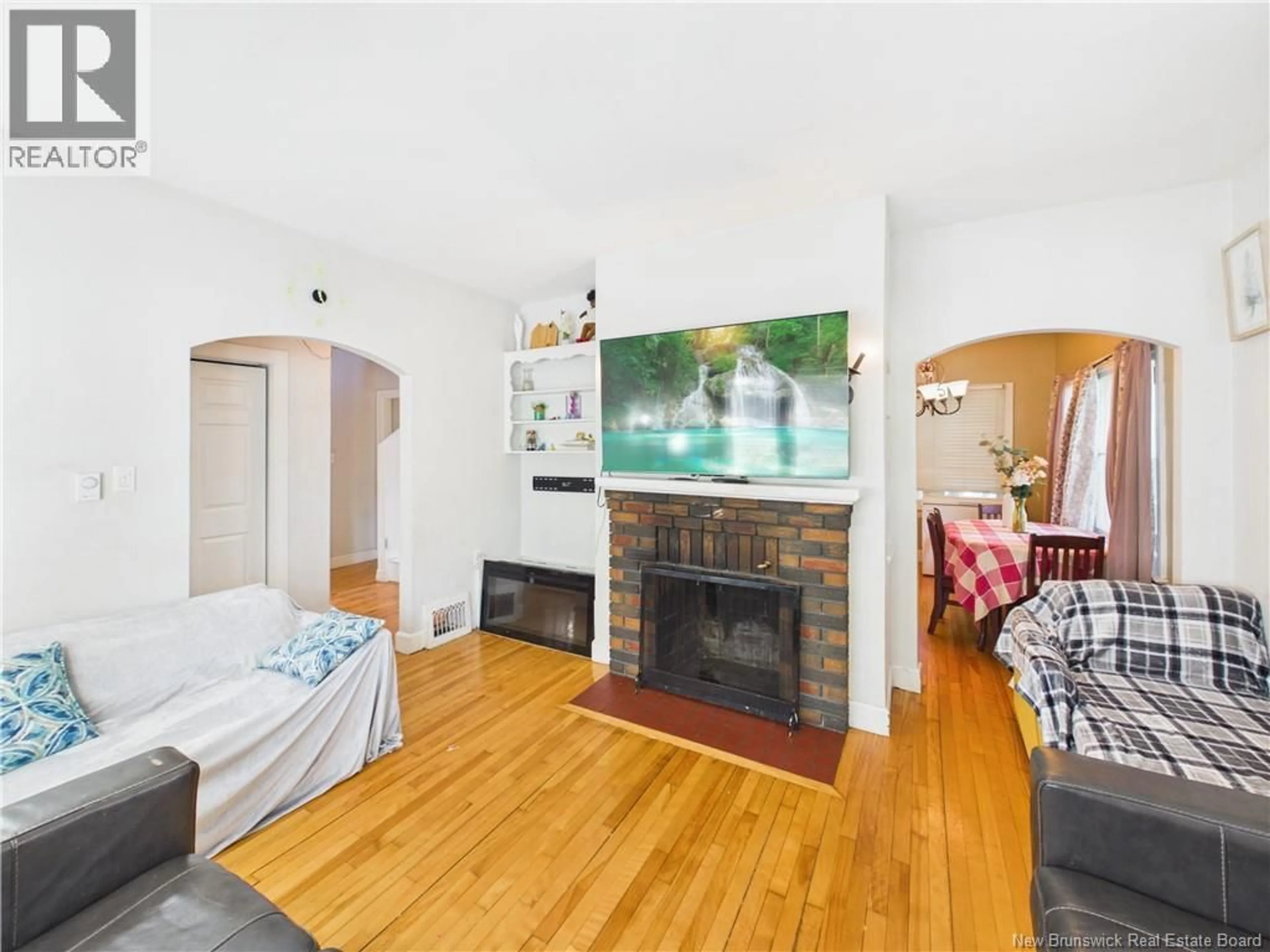 Living room with furniture, wood/laminate floor for 46 DONALD AVENUE, Moncton New Brunswick E1A3B1