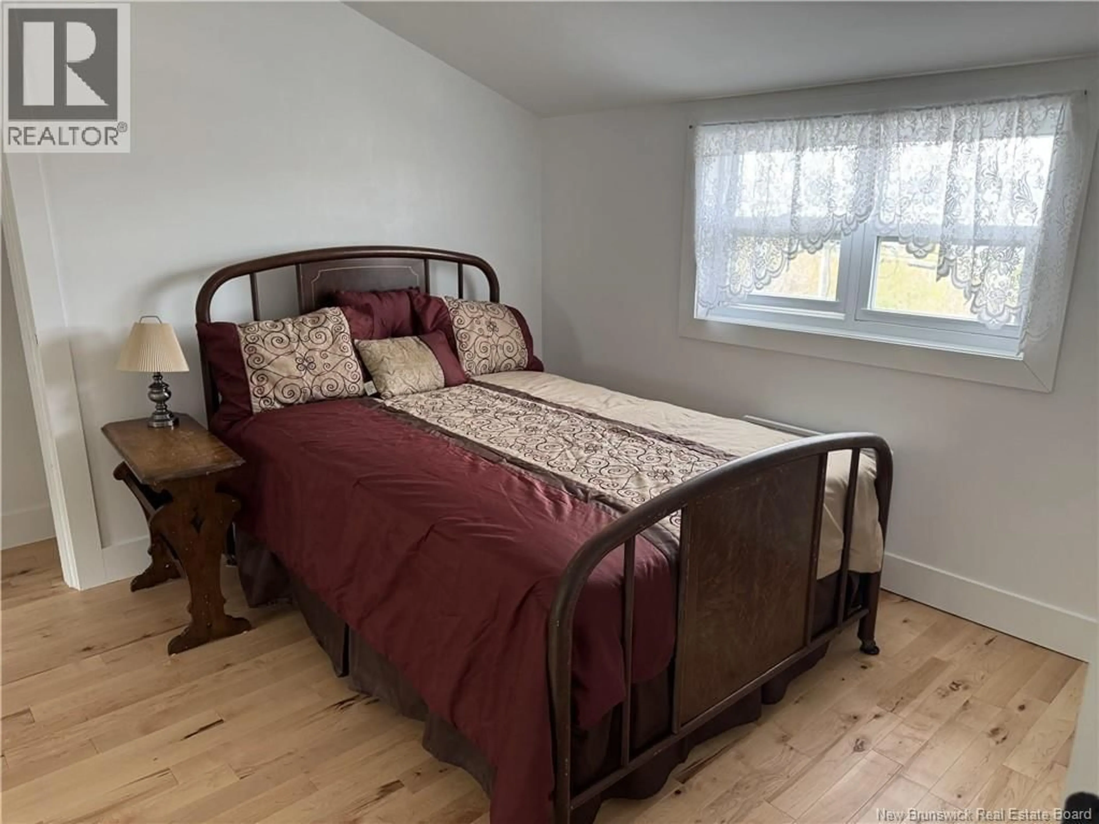 Bedroom with bed, wood/laminate floor for 534 VICTORIA STREET, Dalhousie New Brunswick E8C2T3