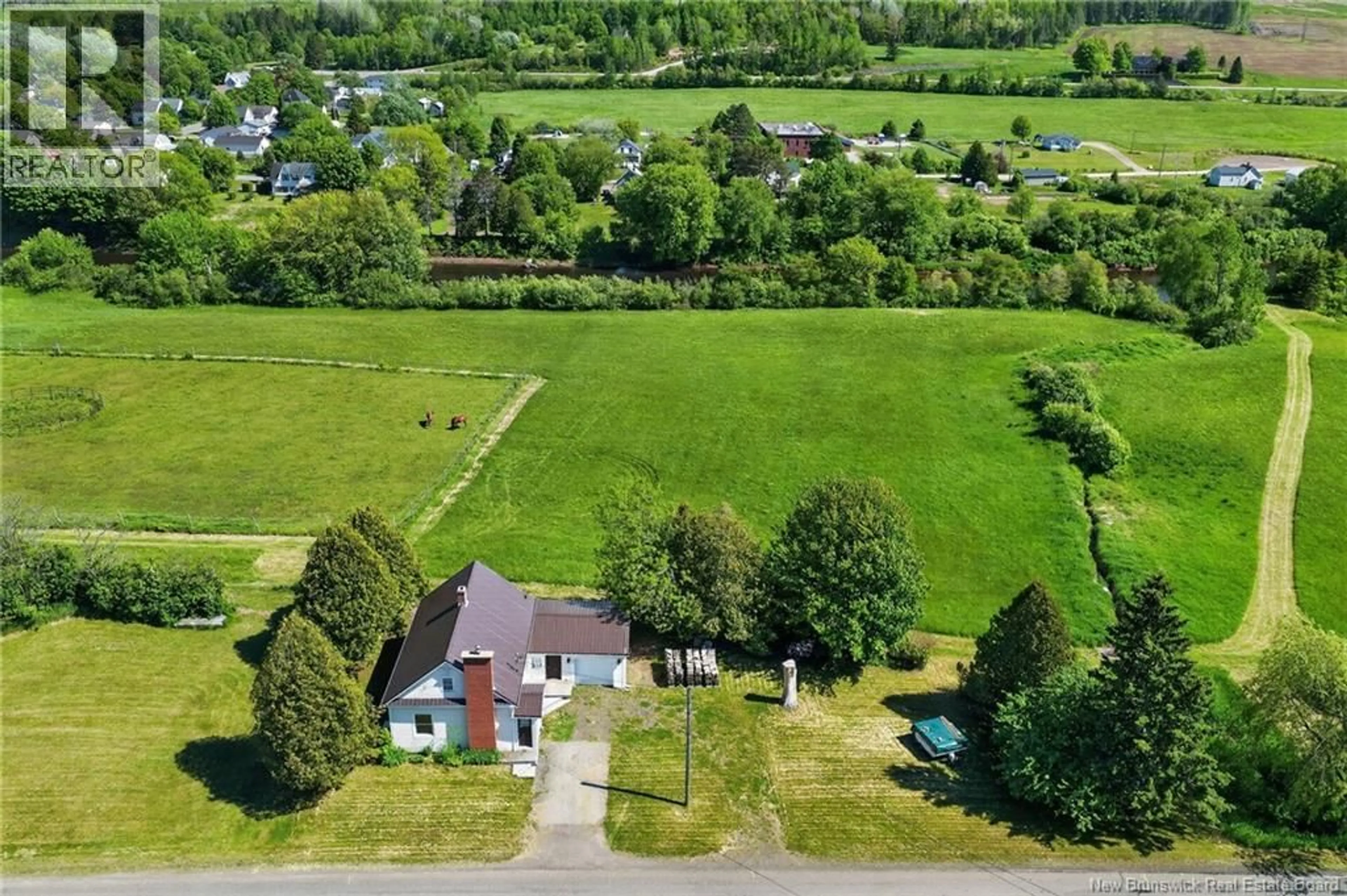 A pic from outside/outdoor area/front of a property/back of a property/a pic from drone, unknown for 2964 ROUTE 121, Apohaqui New Brunswick E5P3X1