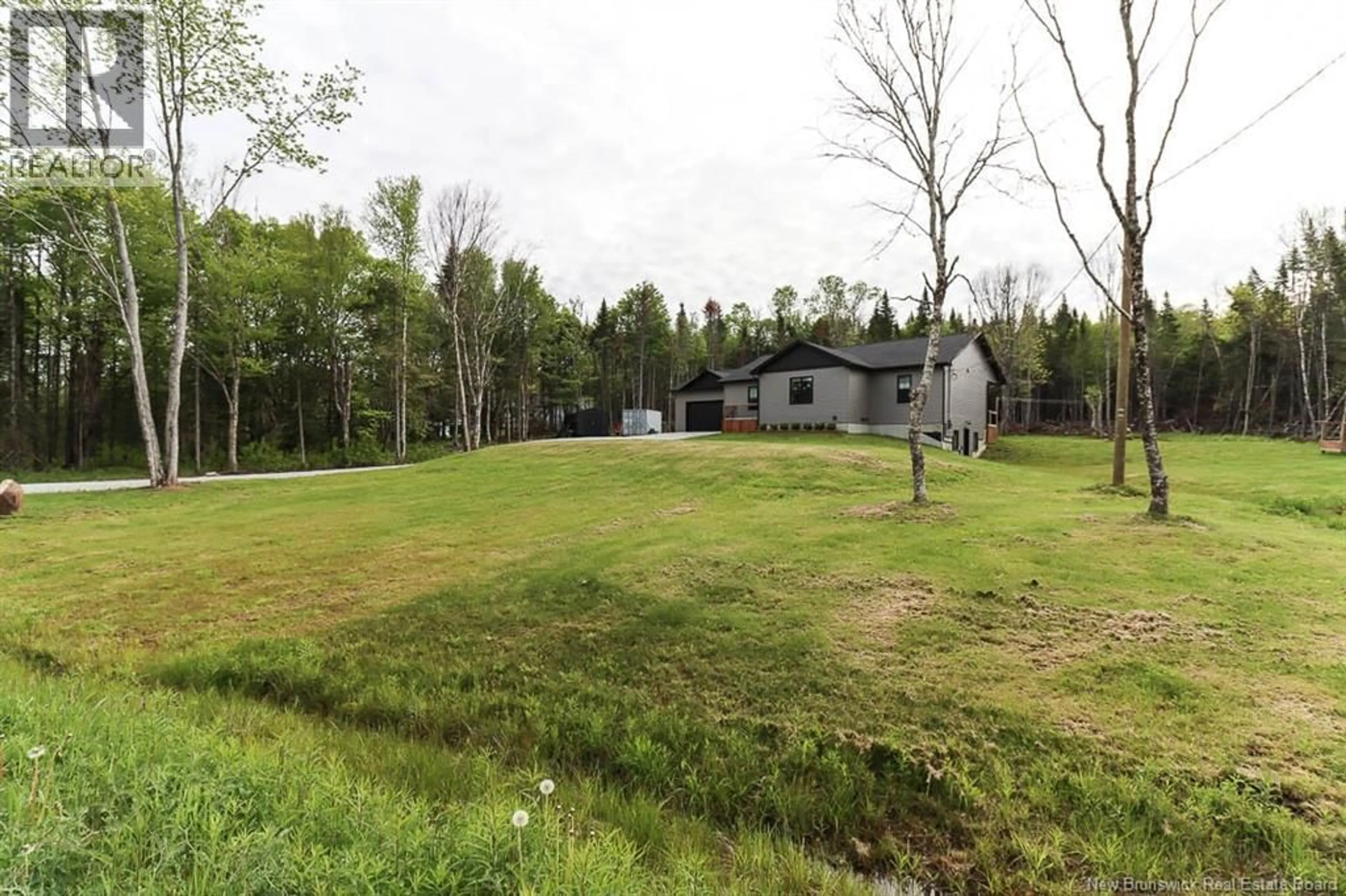 A pic from outside/outdoor area/front of a property/back of a property/a pic from drone, forest/trees view for 130 LAKE ROAD ROAD, Titusville New Brunswick E5N0M7
