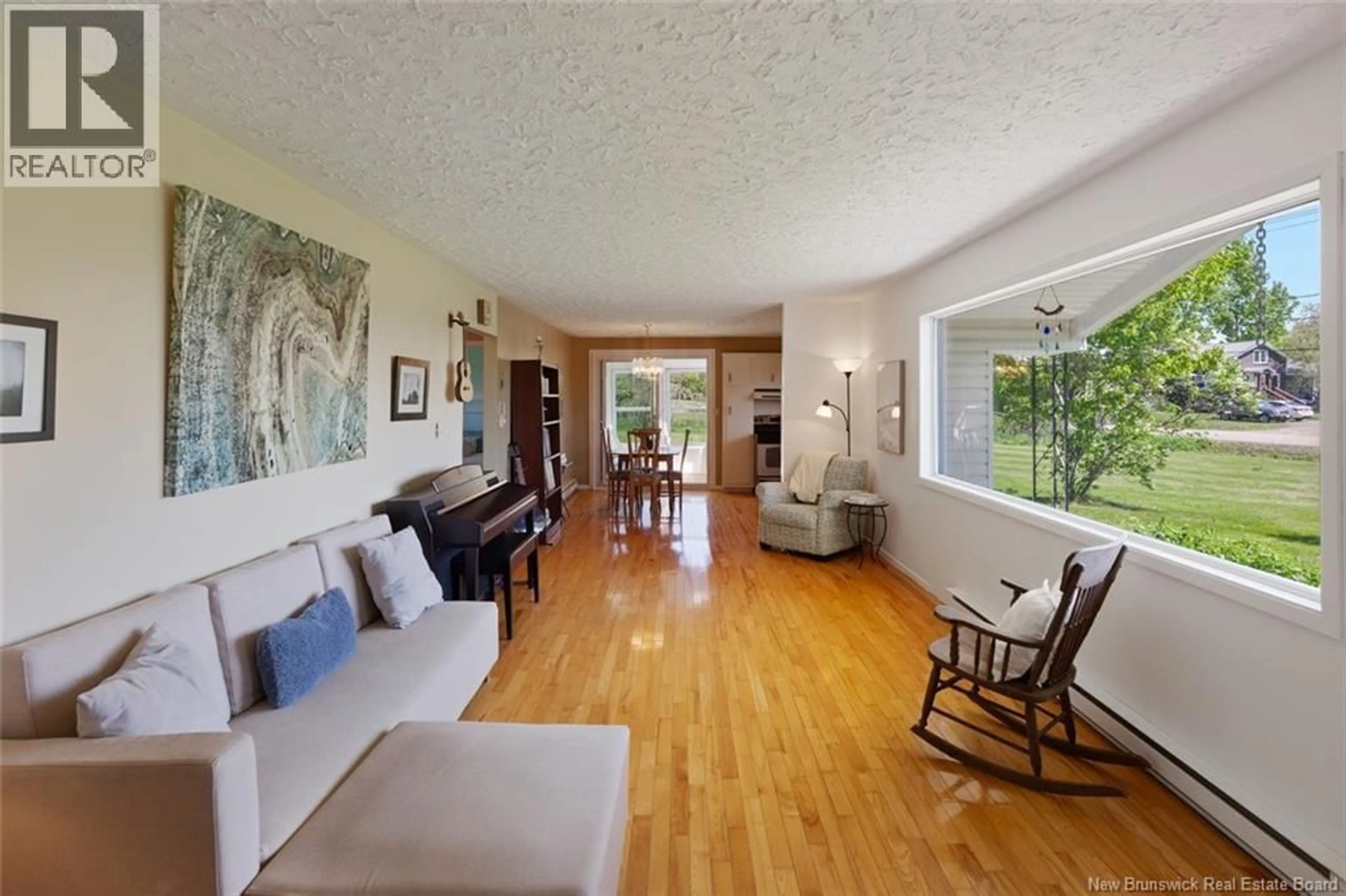 Living room with furniture, wood/laminate floor for 529 ROUTE 530, Grande-Digue New Brunswick E4R5E1