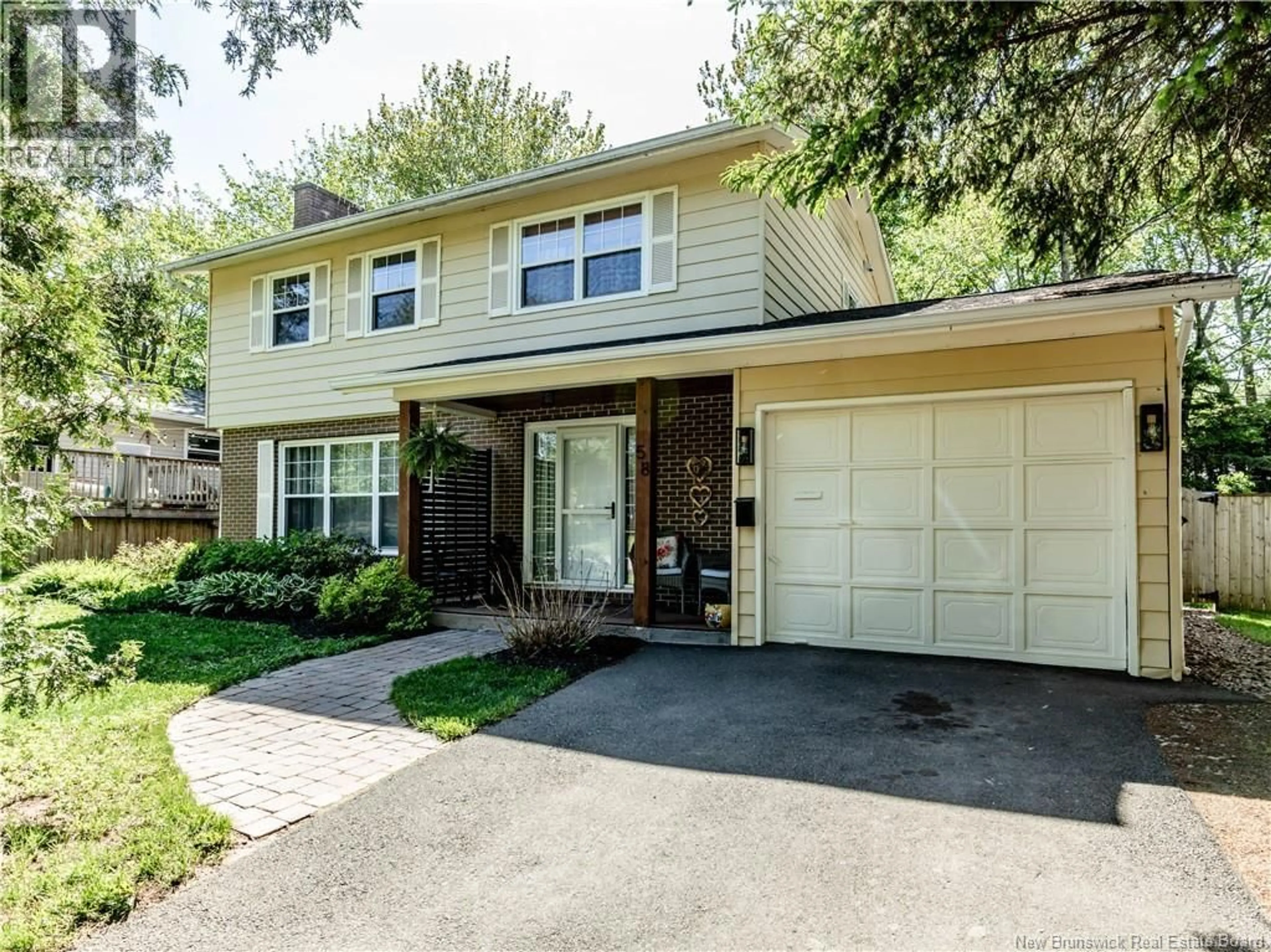 Home with vinyl exterior material, street for 58 BRIARWOOD, Moncton New Brunswick E1E3X2