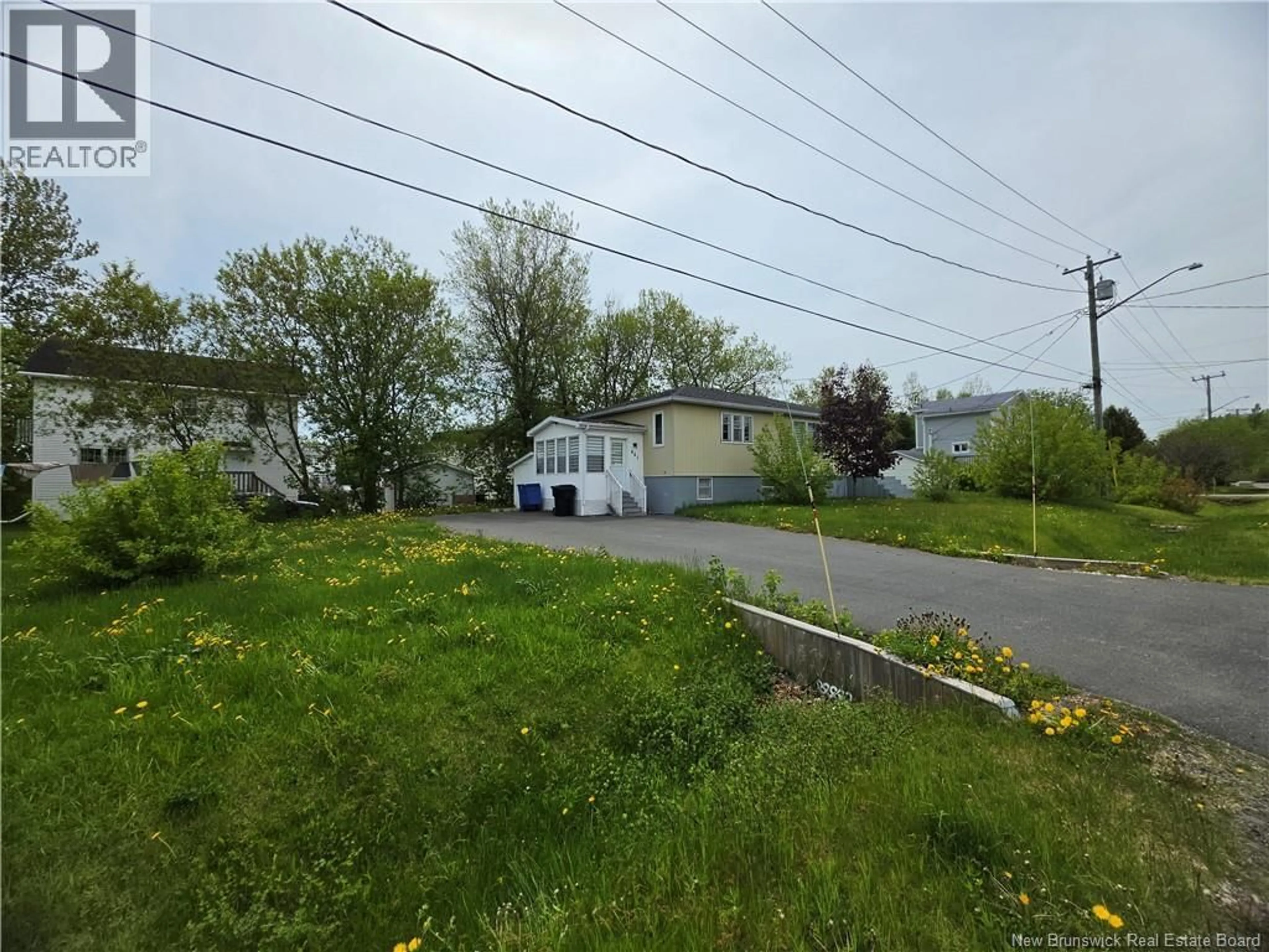 A pic from outside/outdoor area/front of a property/back of a property/a pic from drone, street for 665 ST SIMON, Bathurst New Brunswick E2A3L8