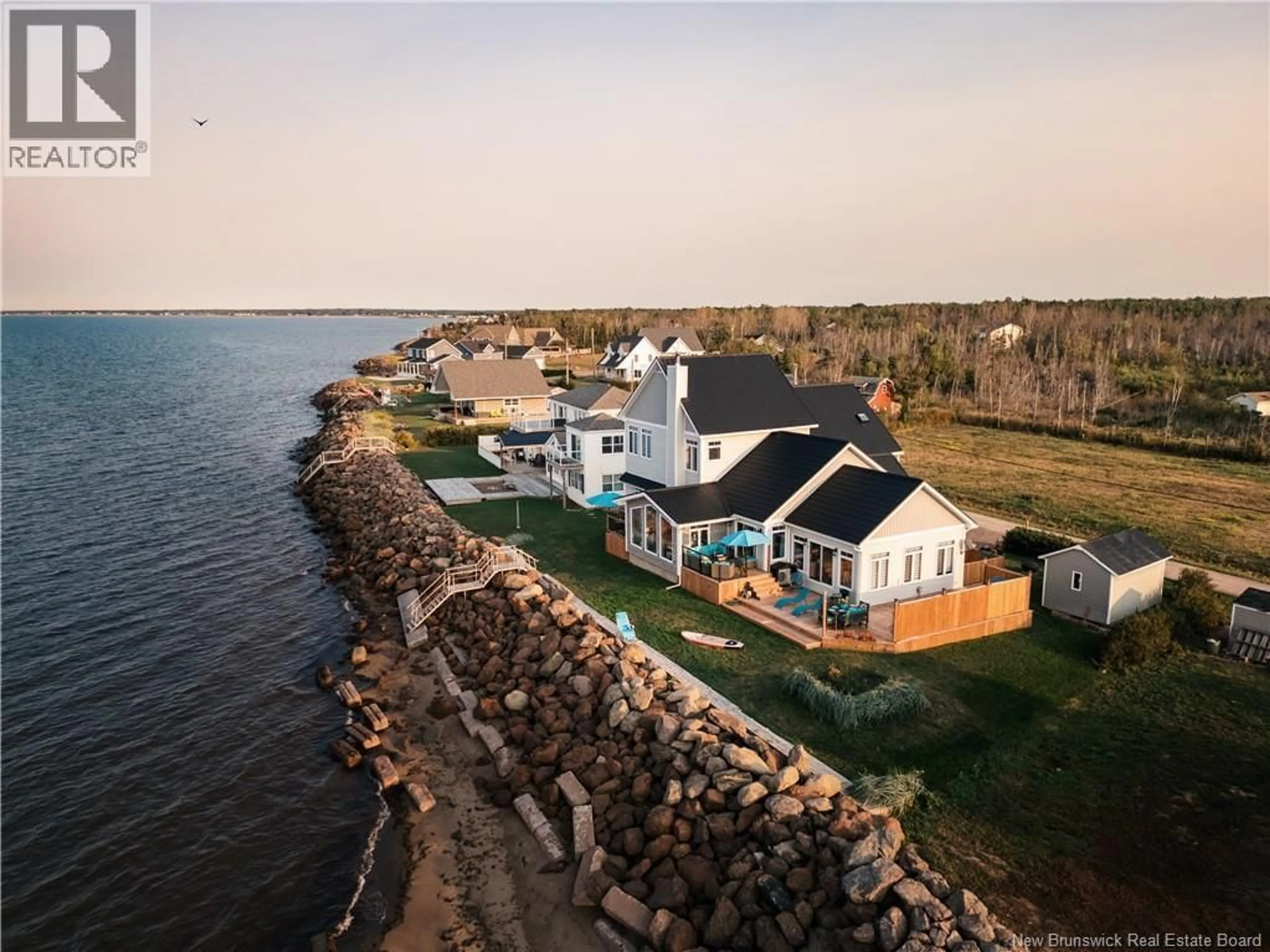 A pic from outside/outdoor area/front of a property/back of a property/a pic from drone, water/lake/river/ocean view for 39 OCEAN BREEZE DRIVE, Grand-Barachois New Brunswick E4P7X3