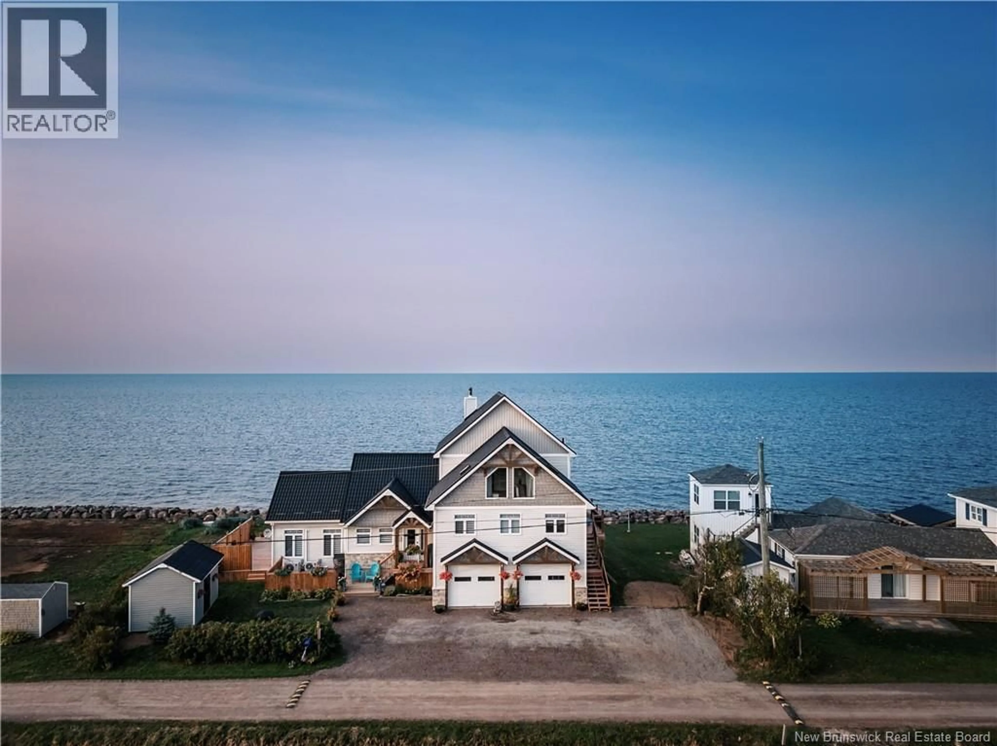 A pic from outside/outdoor area/front of a property/back of a property/a pic from drone, water/lake/river/ocean view for 39 OCEAN BREEZE DRIVE, Grand-Barachois New Brunswick E4P7X3
