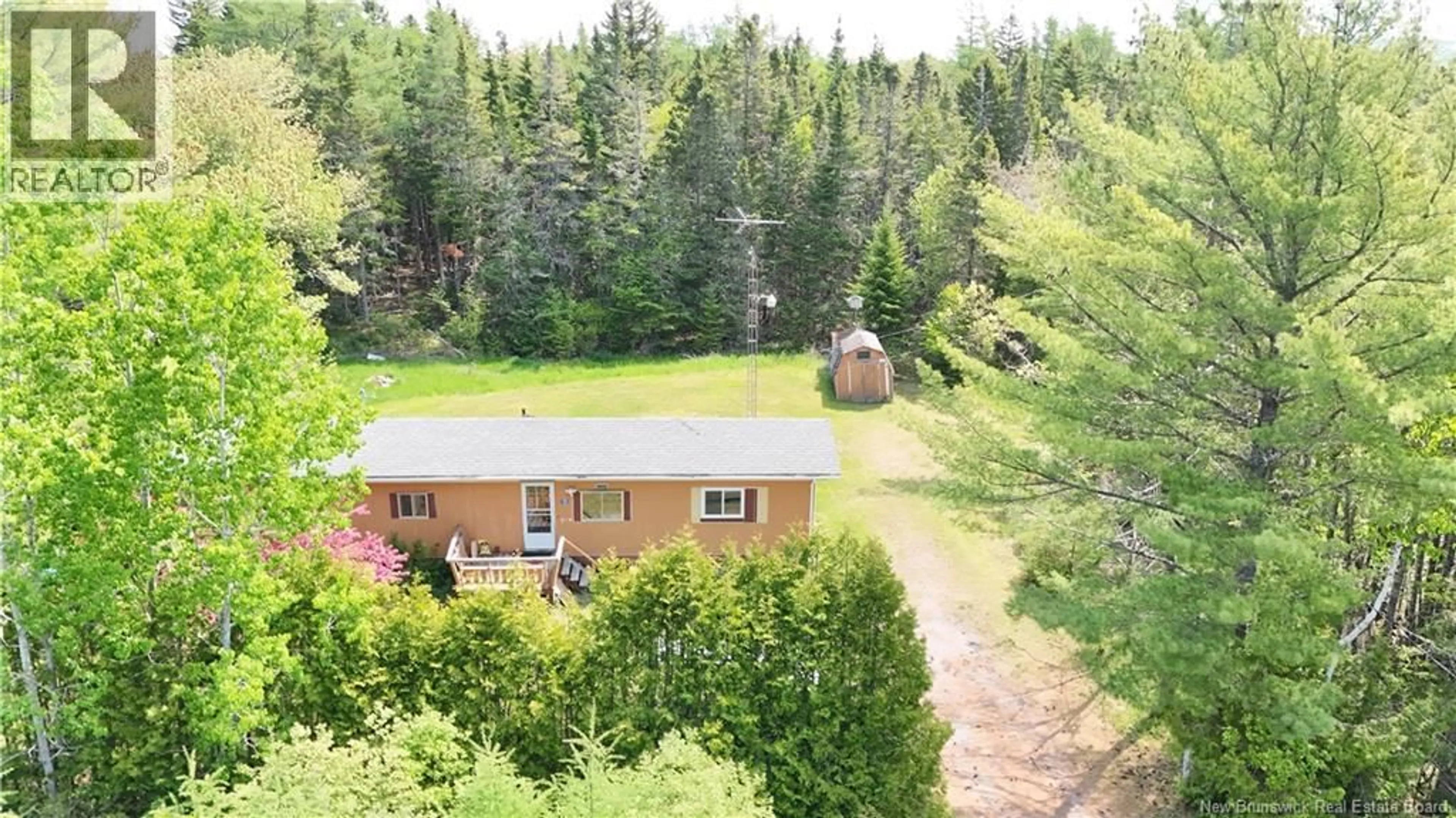 A pic from outside/outdoor area/front of a property/back of a property/a pic from drone, forest/trees view for 15 MARGARET CRESCENT, Lepreau New Brunswick E5J2M5