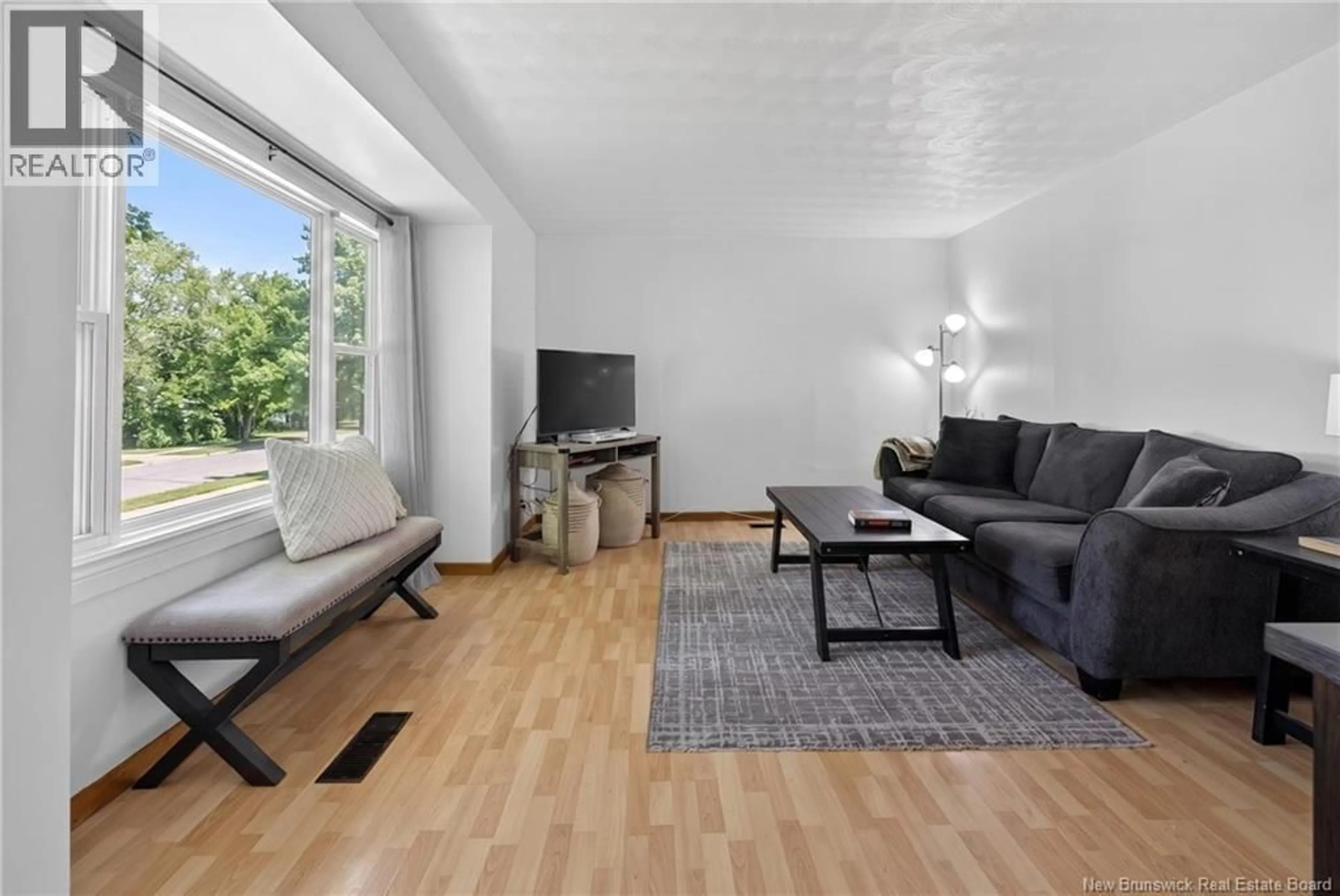 Living room with furniture, wood/laminate floor for 666 KITCHEN STREET, Fredericton New Brunswick E3B3Z5
