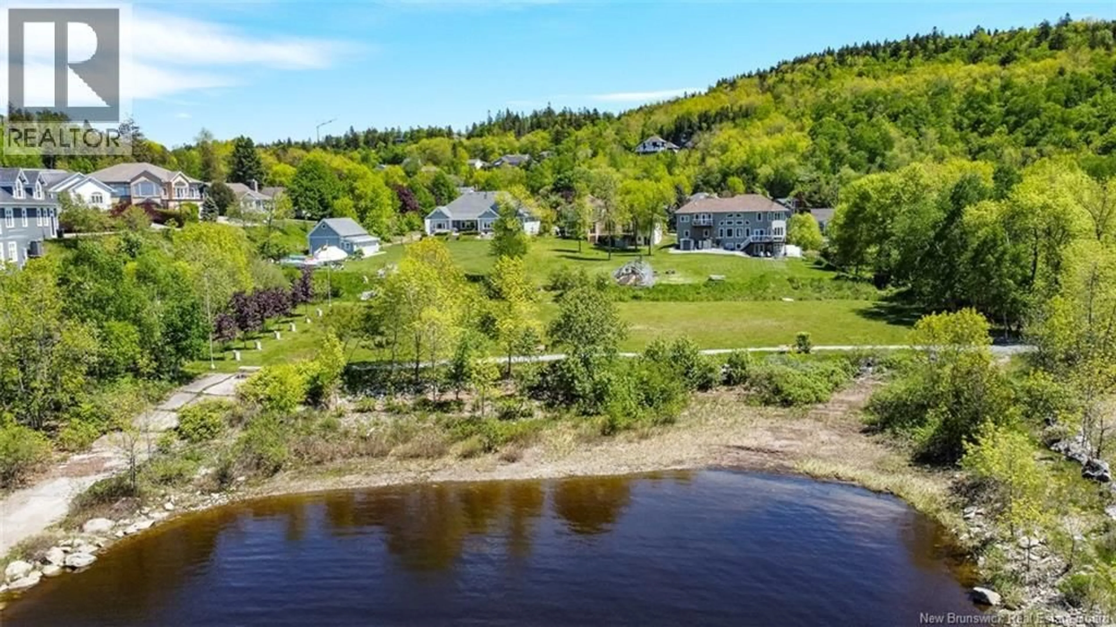 A pic from outside/outdoor area/front of a property/back of a property/a pic from drone, water/lake/river/ocean view for 1117 KENNEBECASIS DRIVE, Saint John New Brunswick E2K5A6