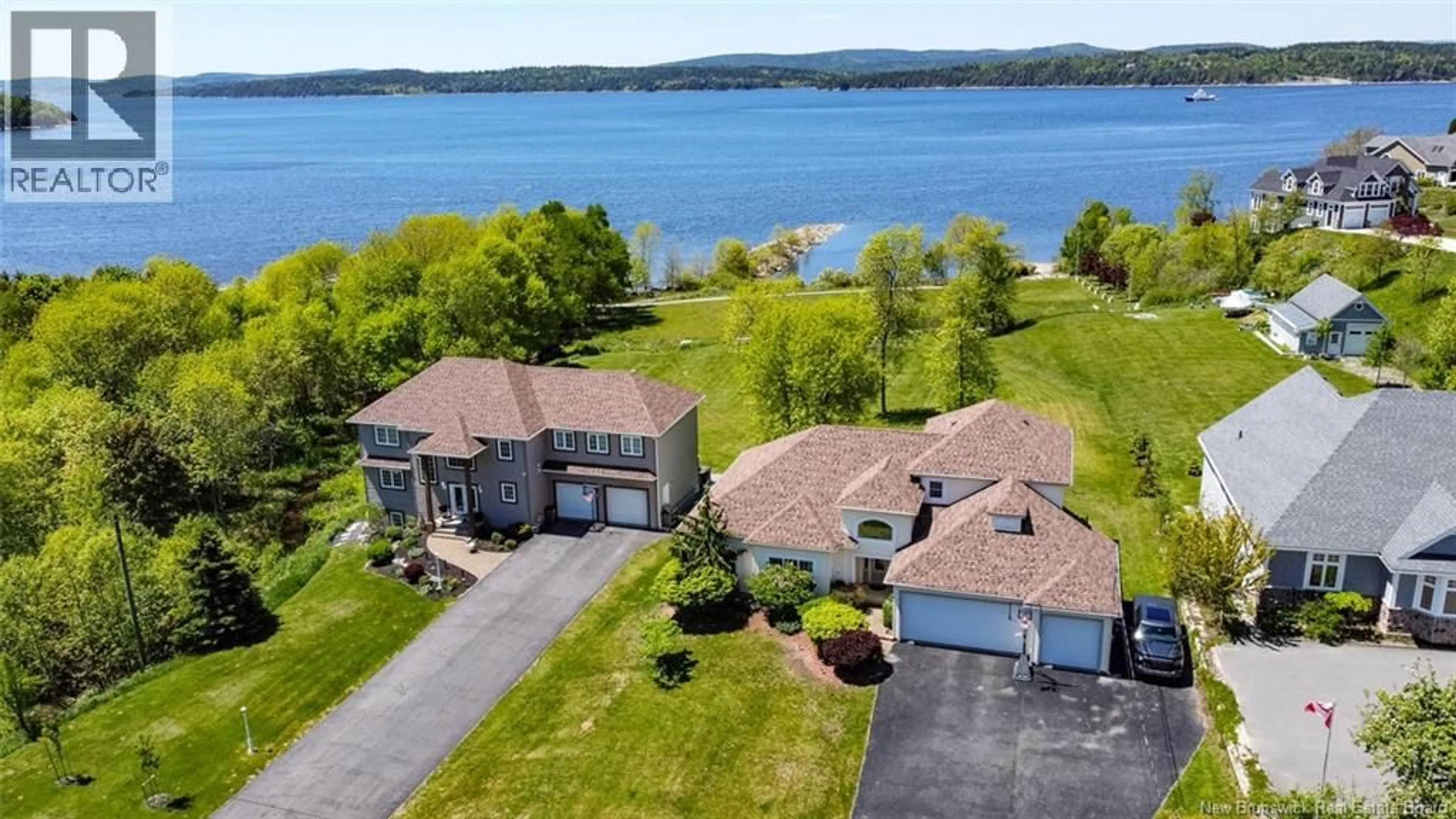 A pic from outside/outdoor area/front of a property/back of a property/a pic from drone, water/lake/river/ocean view for 1117 KENNEBECASIS DRIVE, Saint John New Brunswick E2K5A6