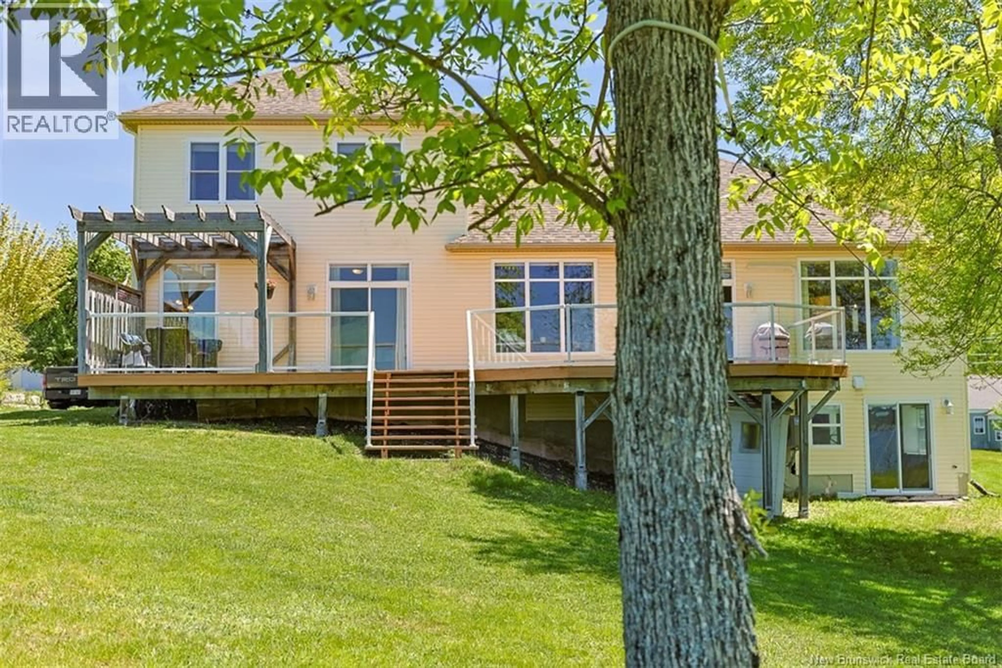 A pic from outside/outdoor area/front of a property/back of a property/a pic from drone, water/lake/river/ocean view for 1117 KENNEBECASIS DRIVE, Saint John New Brunswick E2K5A6