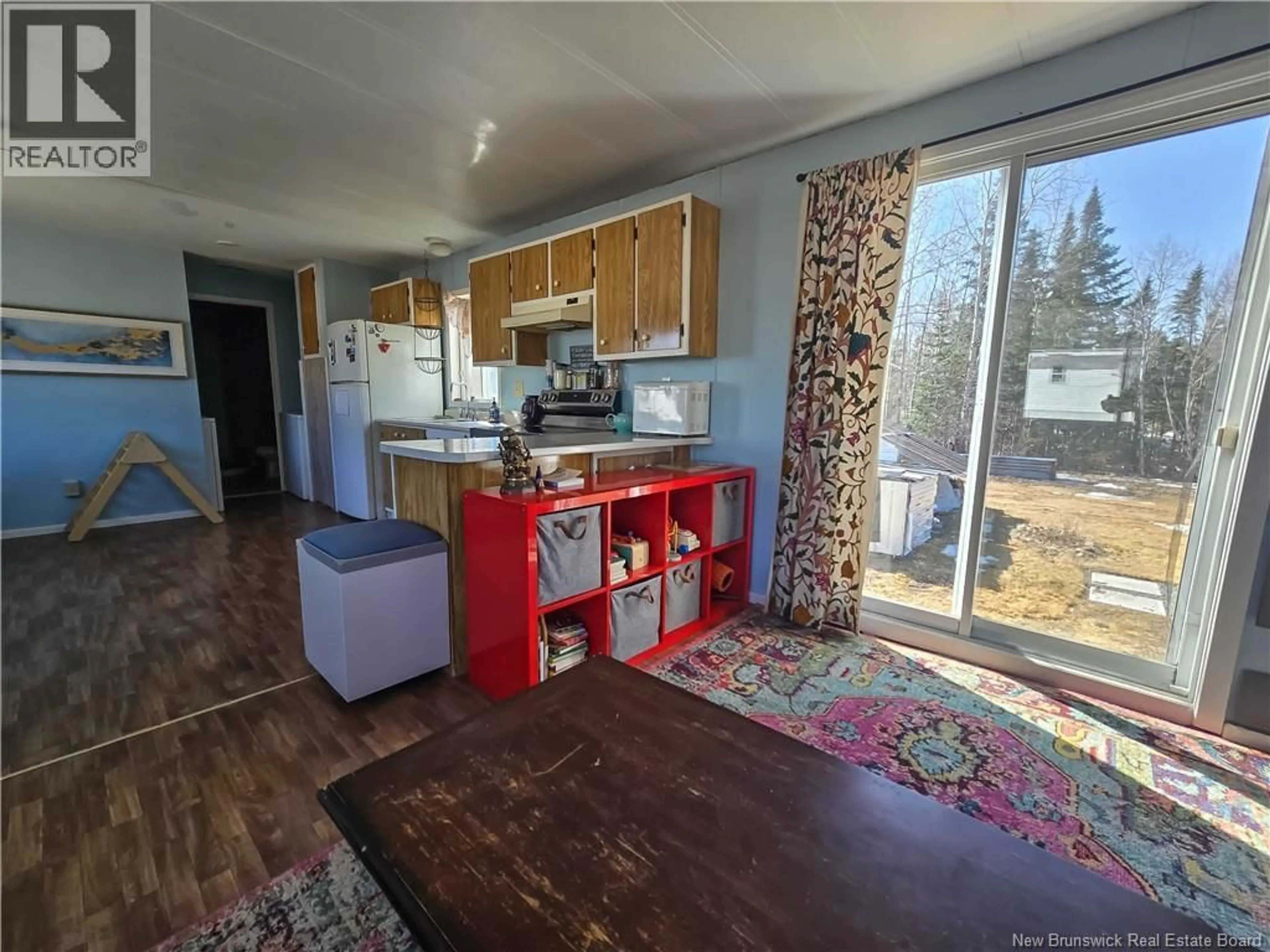 Open concept kitchen, wood/laminate floor for 336 MACLAGGAN DRIVE, Blackville New Brunswick E9B1H7