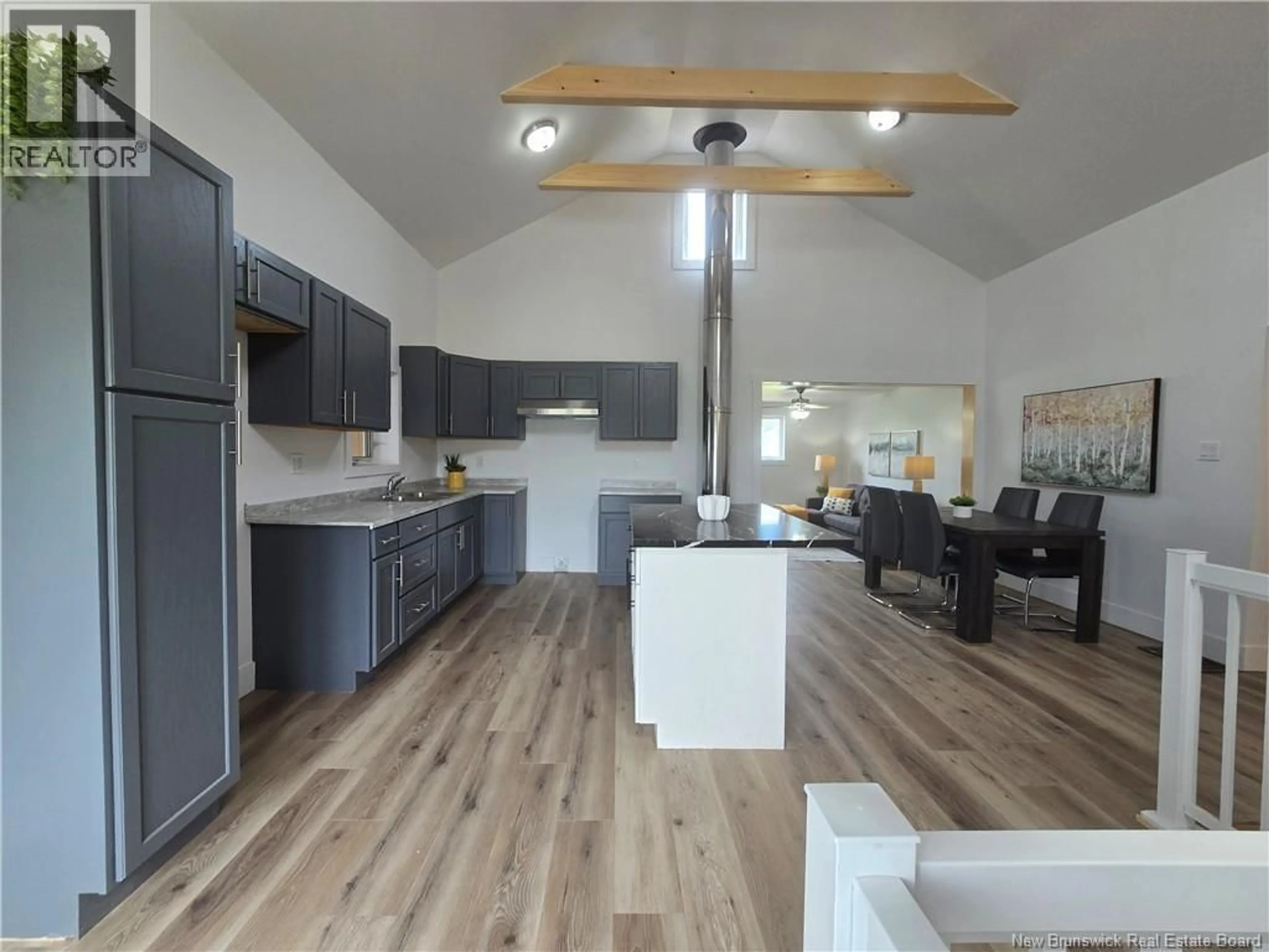 Open concept kitchen, wood/laminate floor for 5000 ROUTE 11, Brantville New Brunswick E9H1M9