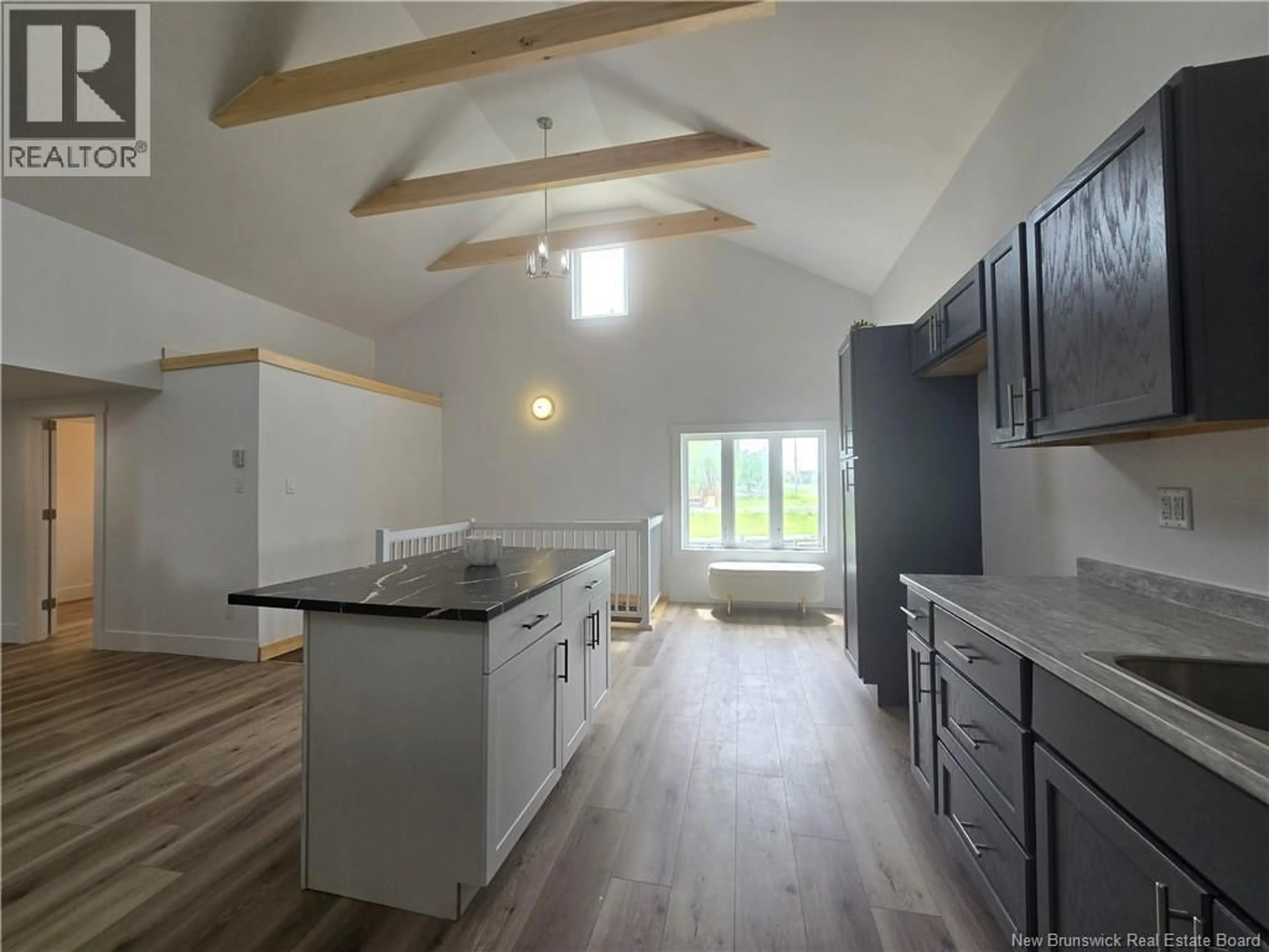 Open concept kitchen, wood/laminate floor for 5000 ROUTE 11, Brantville New Brunswick E9H1M9