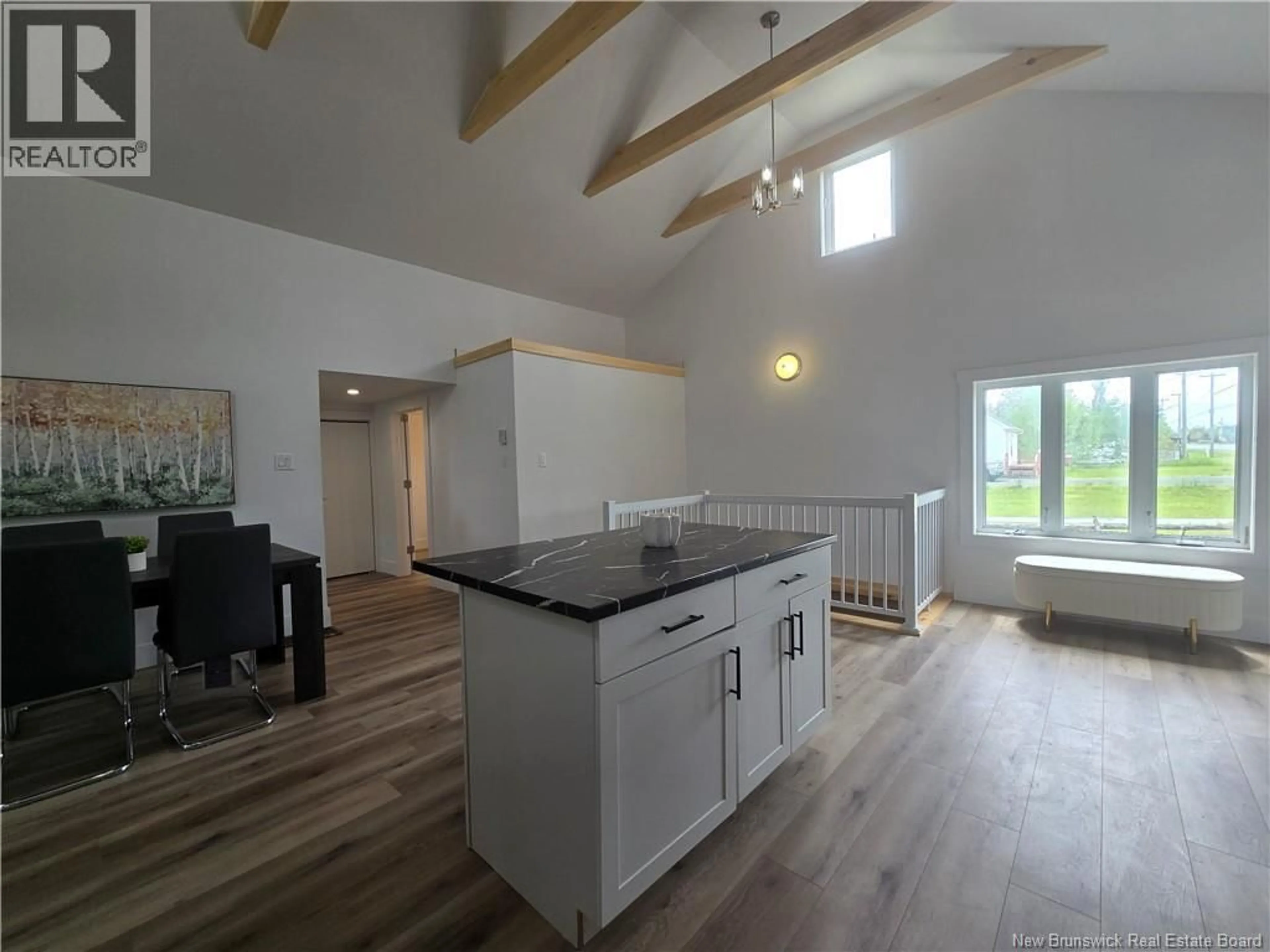 Open concept kitchen, wood/laminate floor for 5000 ROUTE 11, Brantville New Brunswick E9H1M9