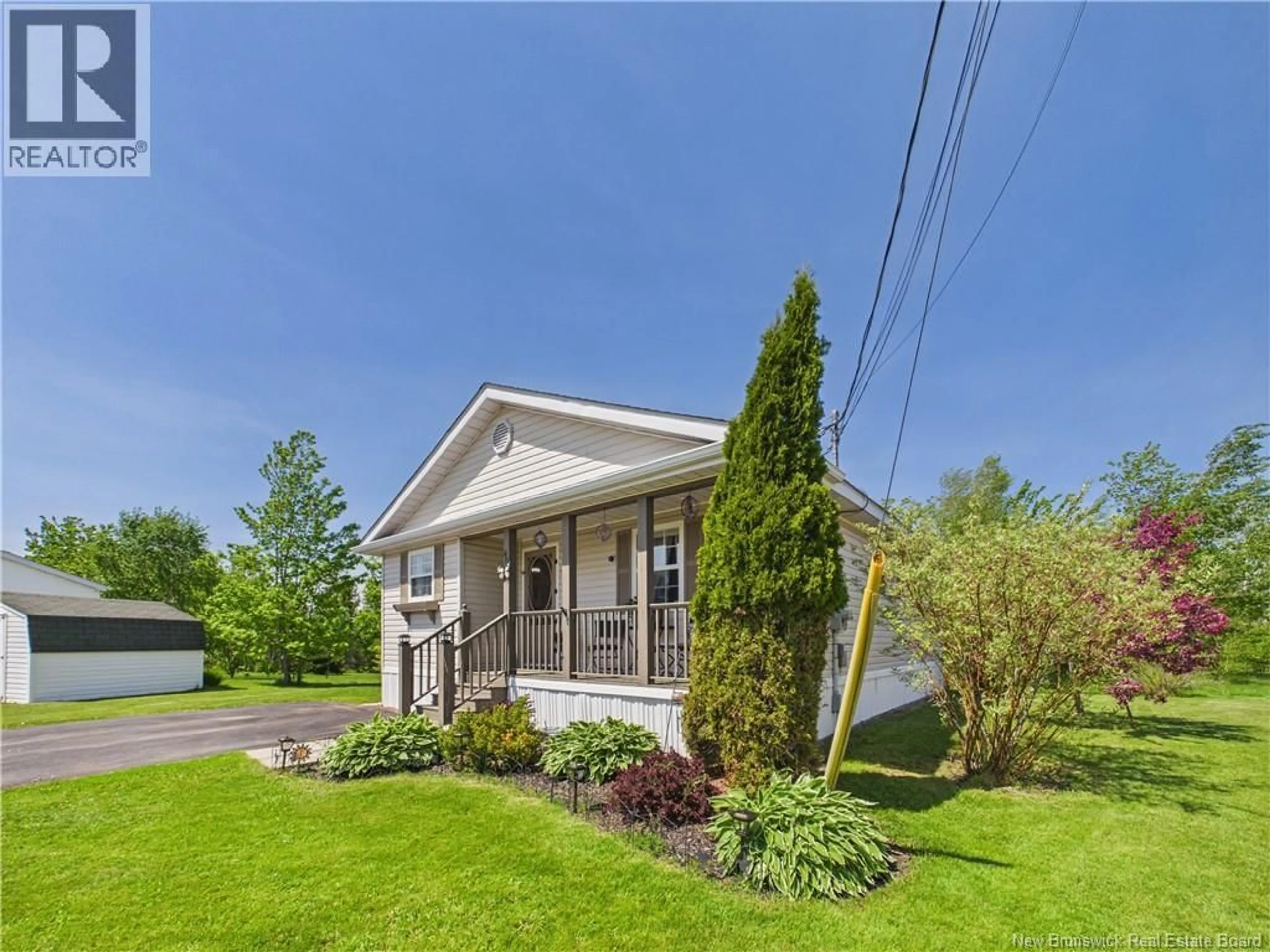 Home with vinyl exterior material, street for 40 RICHIBUCTOU LANE, Dieppe New Brunswick E1A7N1