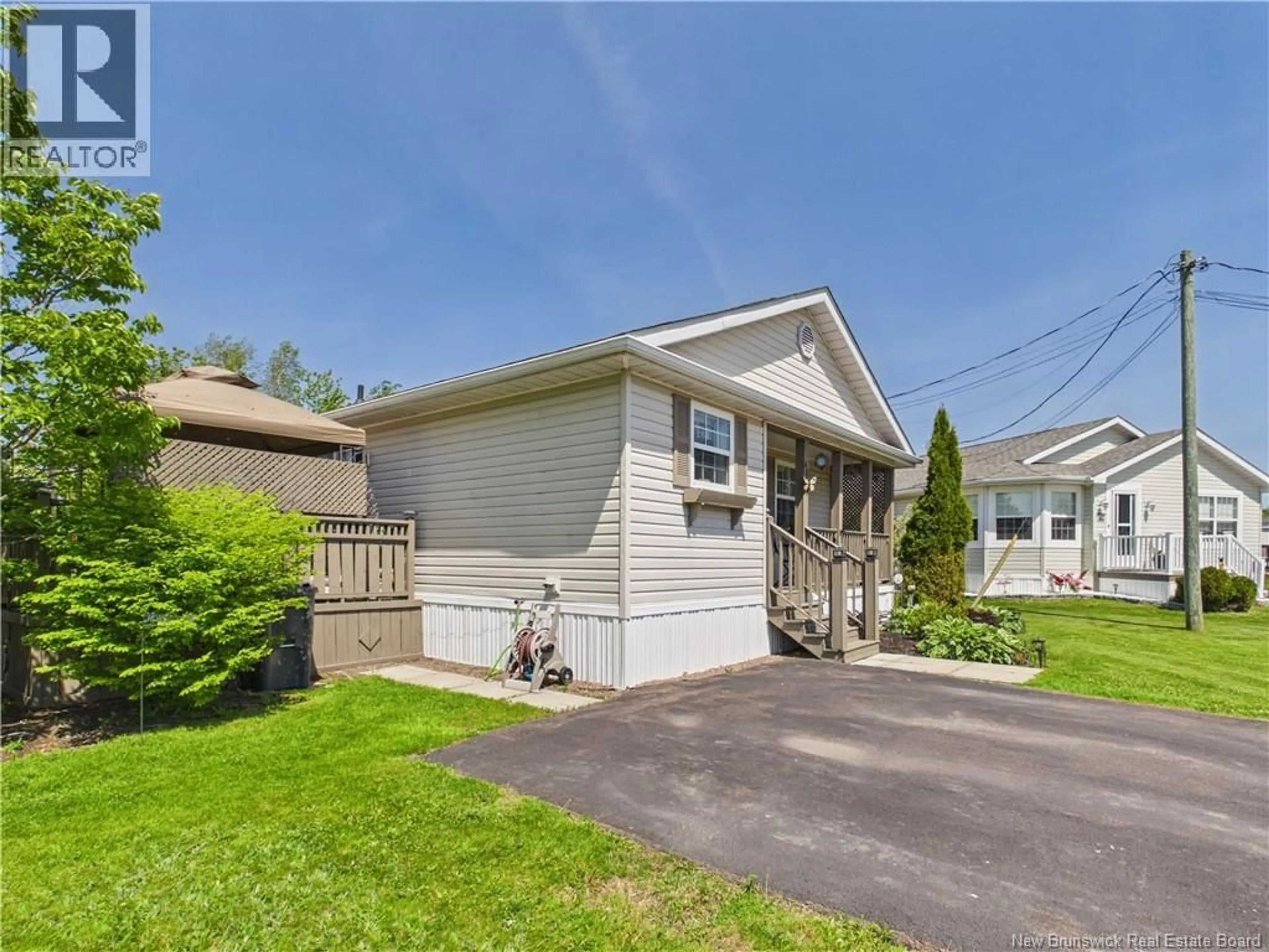 Home with vinyl exterior material, street for 40 RICHIBUCTOU LANE, Dieppe New Brunswick E1A7N1