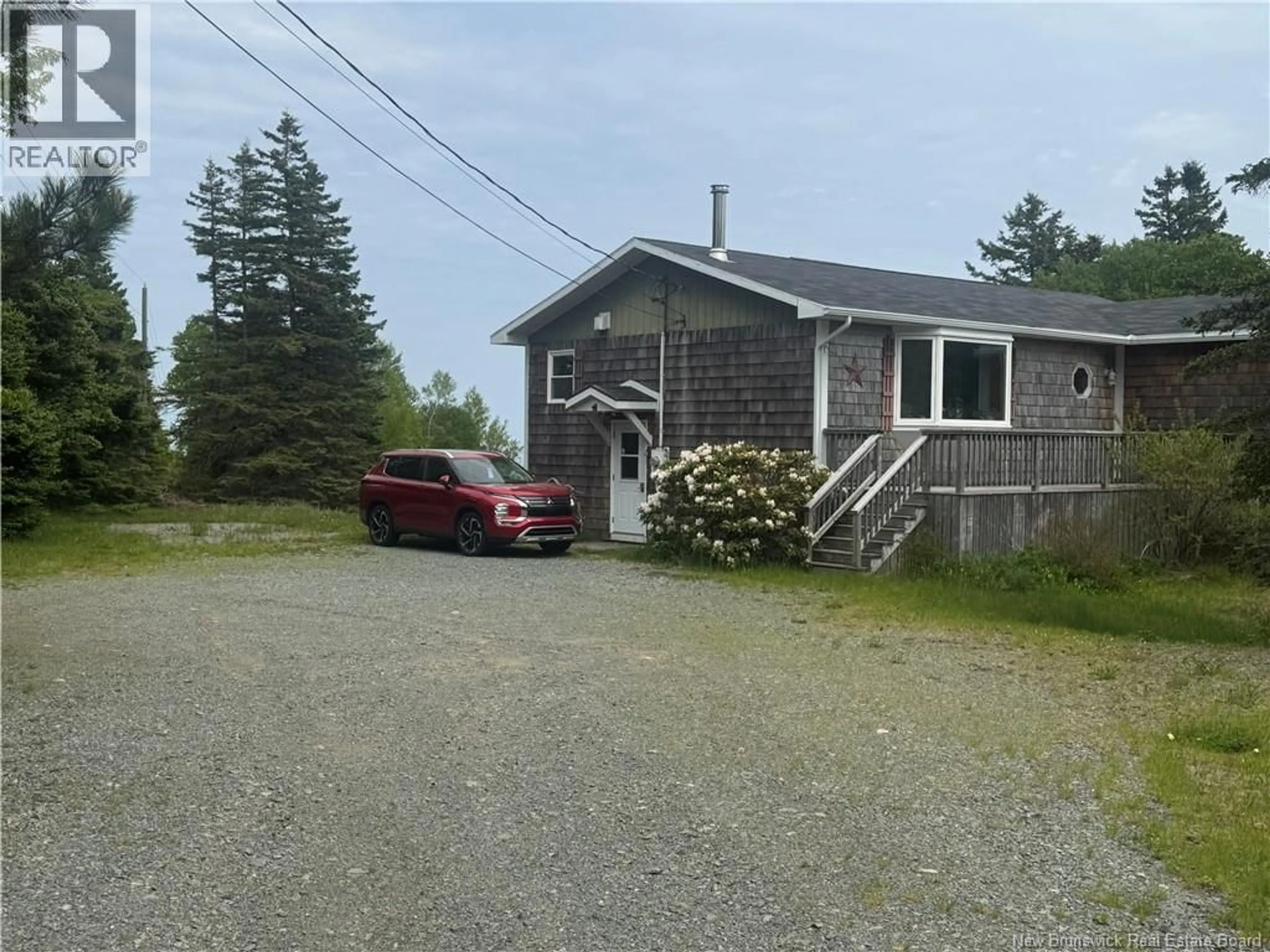 A pic from outside/outdoor area/front of a property/back of a property/a pic from drone, street for 208 WHISTLE ROAD, Grand Manan New Brunswick E5G1B5