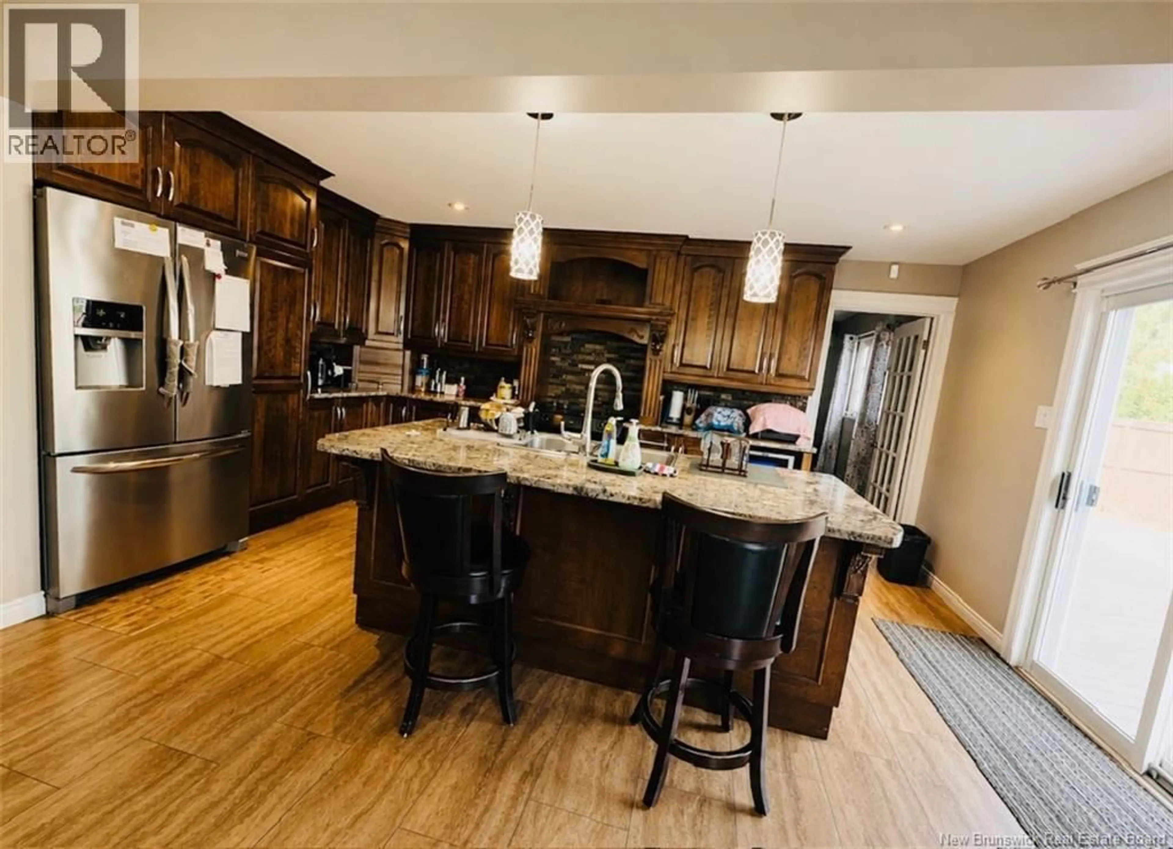 Open concept kitchen, wood/laminate floor for 12 BROOK TERRACE, Campbellton New Brunswick E3N3T3