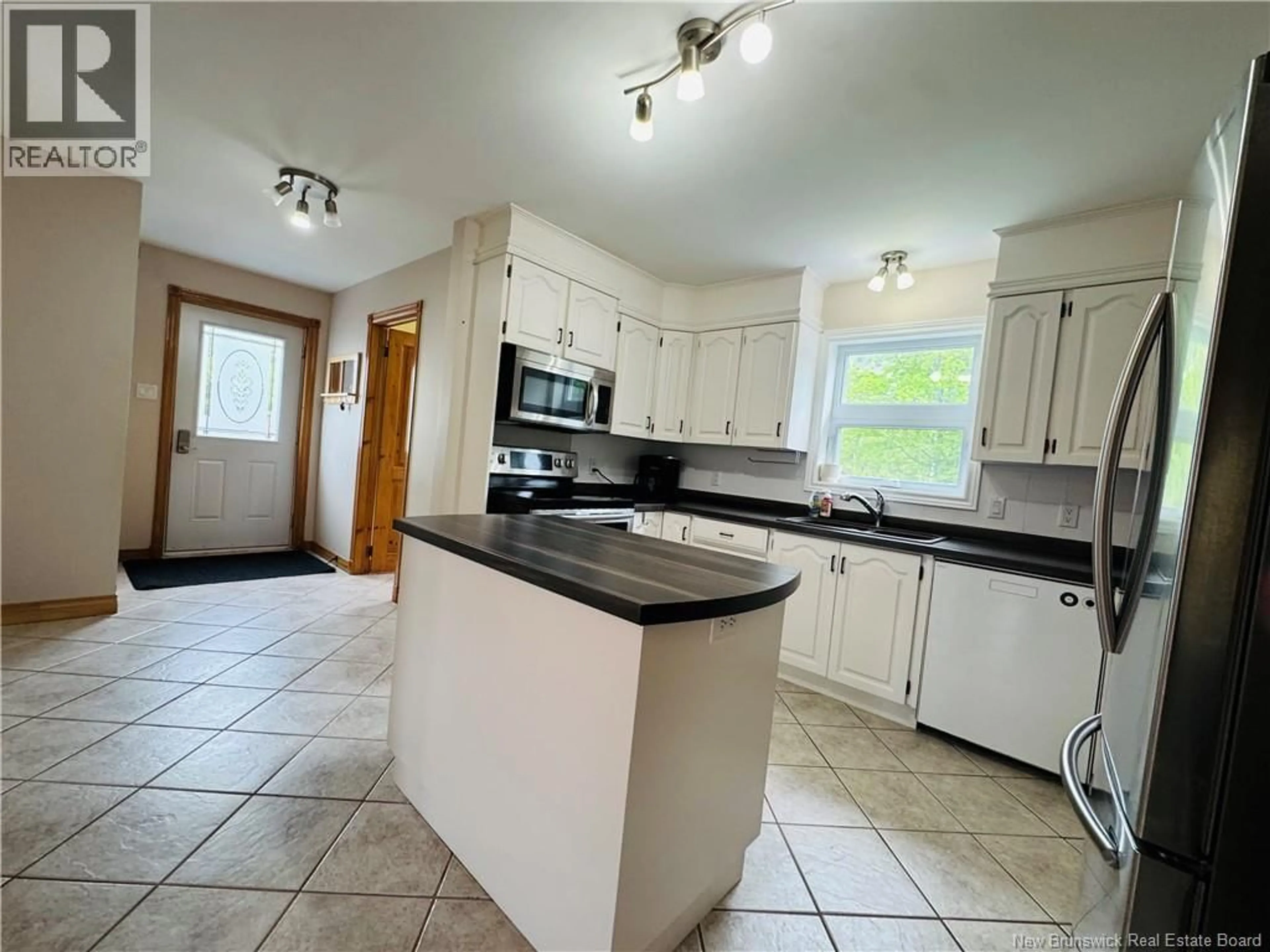 Open concept kitchen, ceramic/tile floor for 34 WALKER CRESCENT, Campbellton New Brunswick E3N3N8