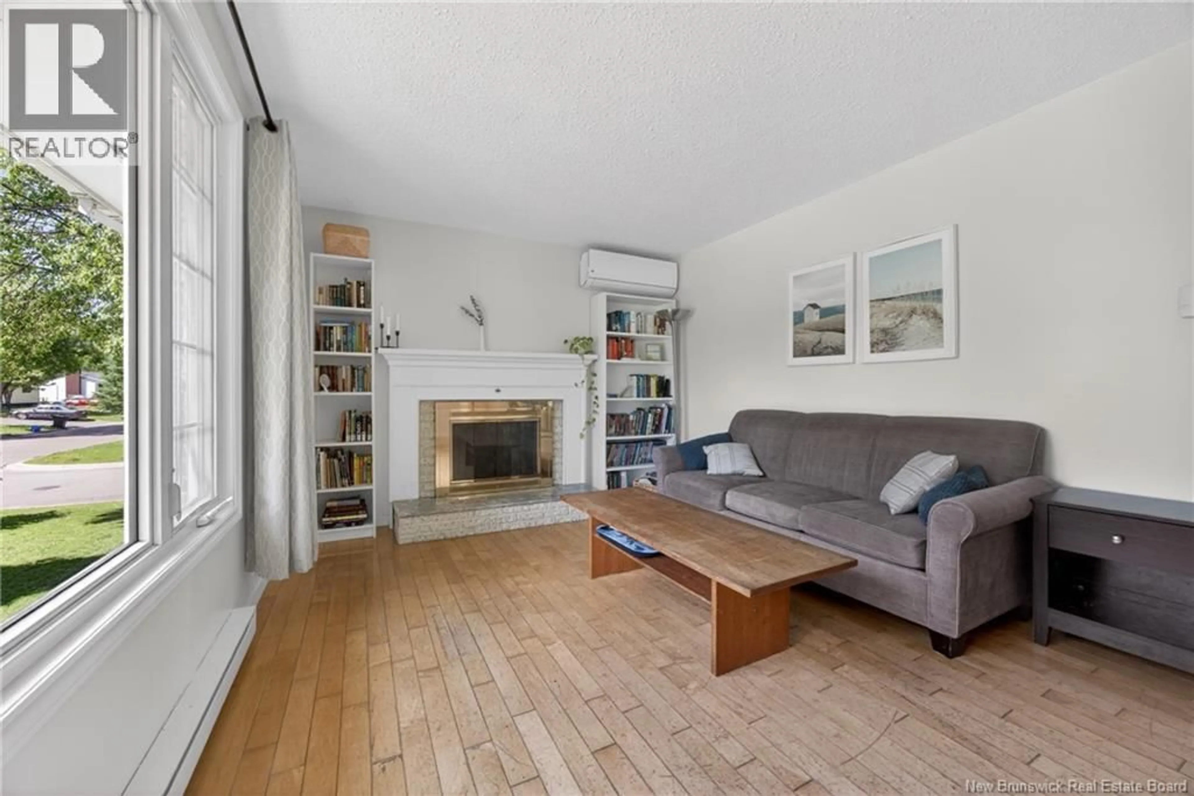 Living room with furniture, wood/laminate floor for 18 DICKSON STREET, Fredericton New Brunswick E3A5A7
