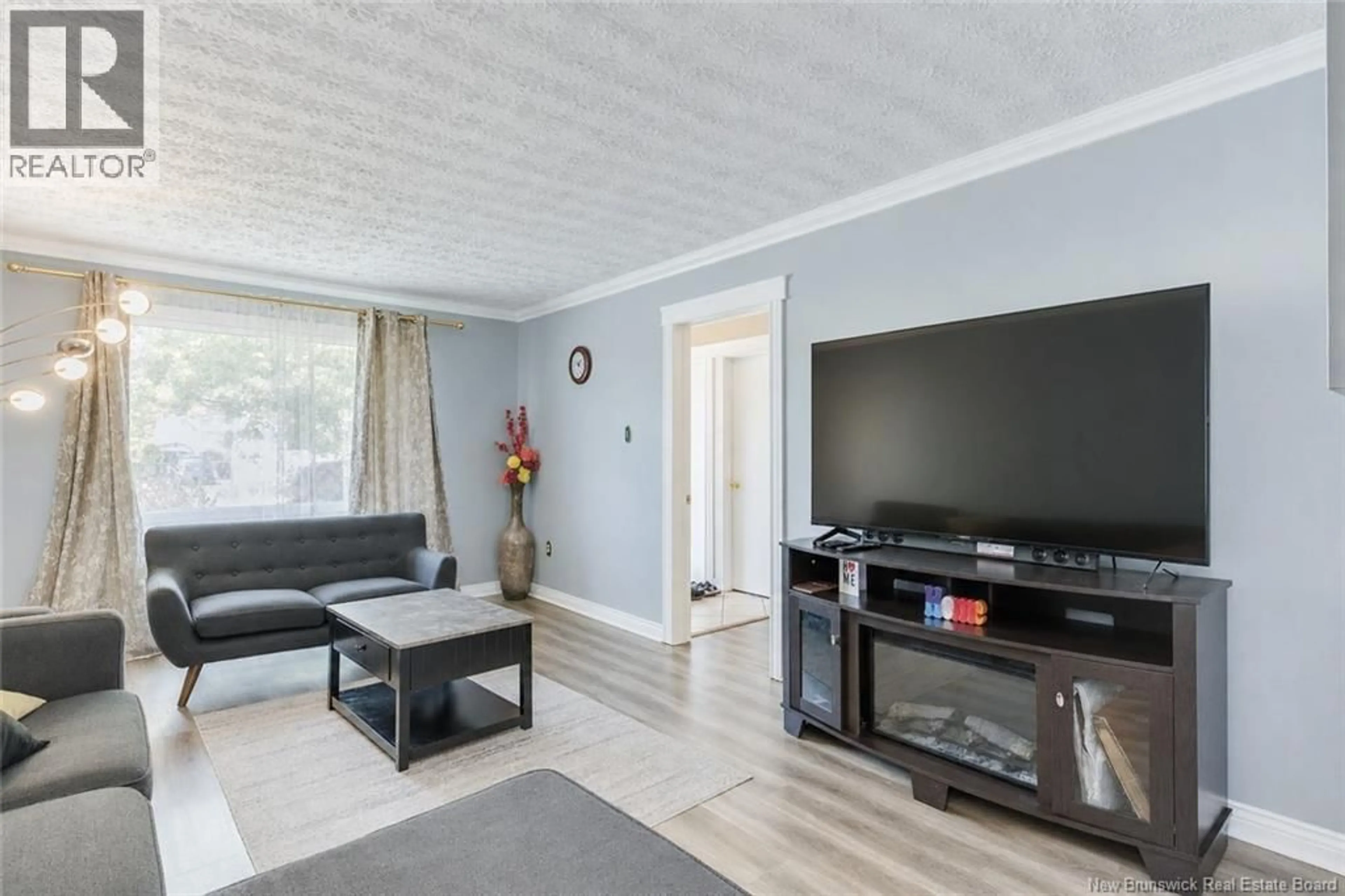 Living room with furniture, wood/laminate floor for 54 BON ACCORD DRIVE, Saint John New Brunswick E2J3V6