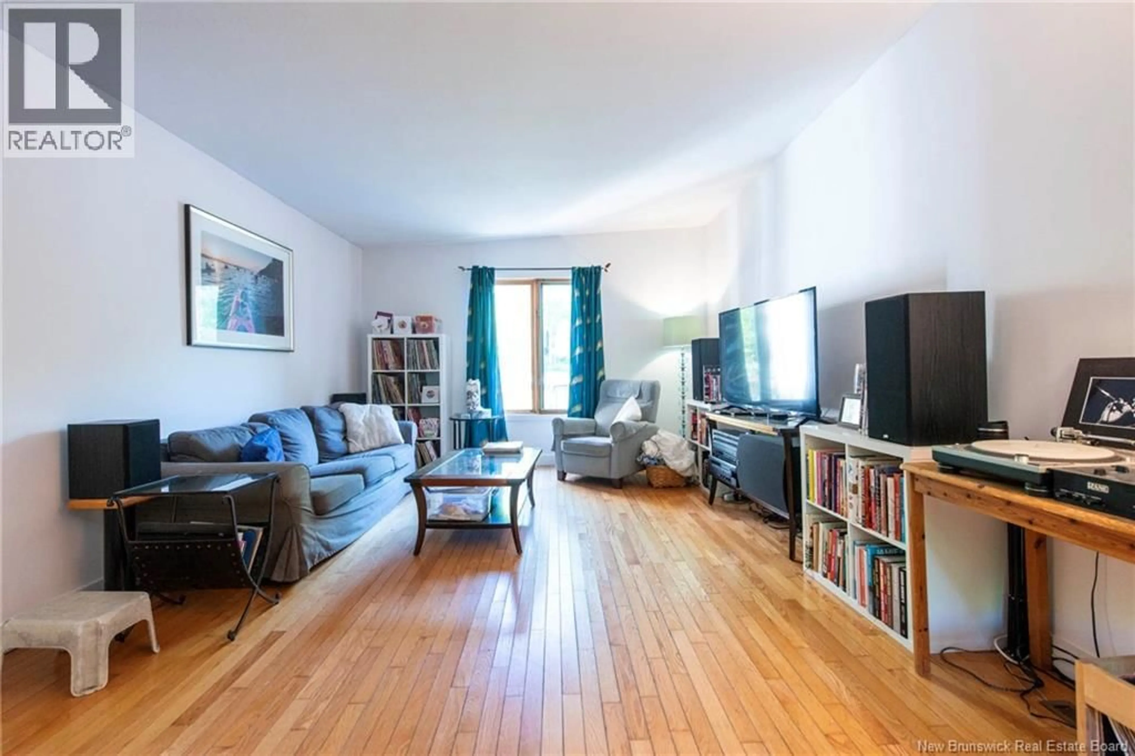 Living room with furniture, wood/laminate floor for 13 IONA AVENUE, Rothesay New Brunswick E2E3H6