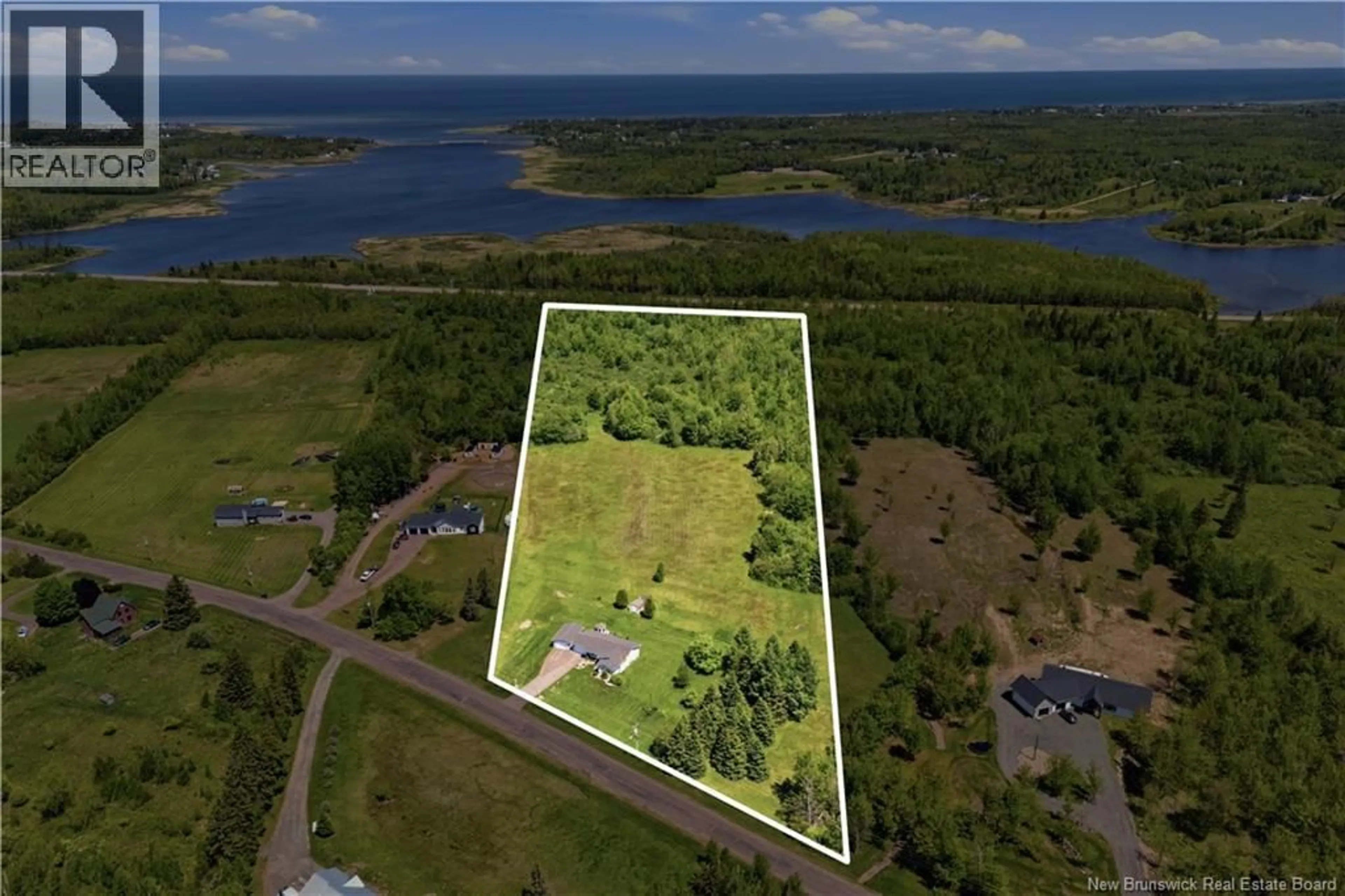 A pic from outside/outdoor area/front of a property/back of a property/a pic from drone, water/lake/river/ocean view for 294 CORMIER VILLAGE ROAD, Cormier Village New Brunswick E4P5W7