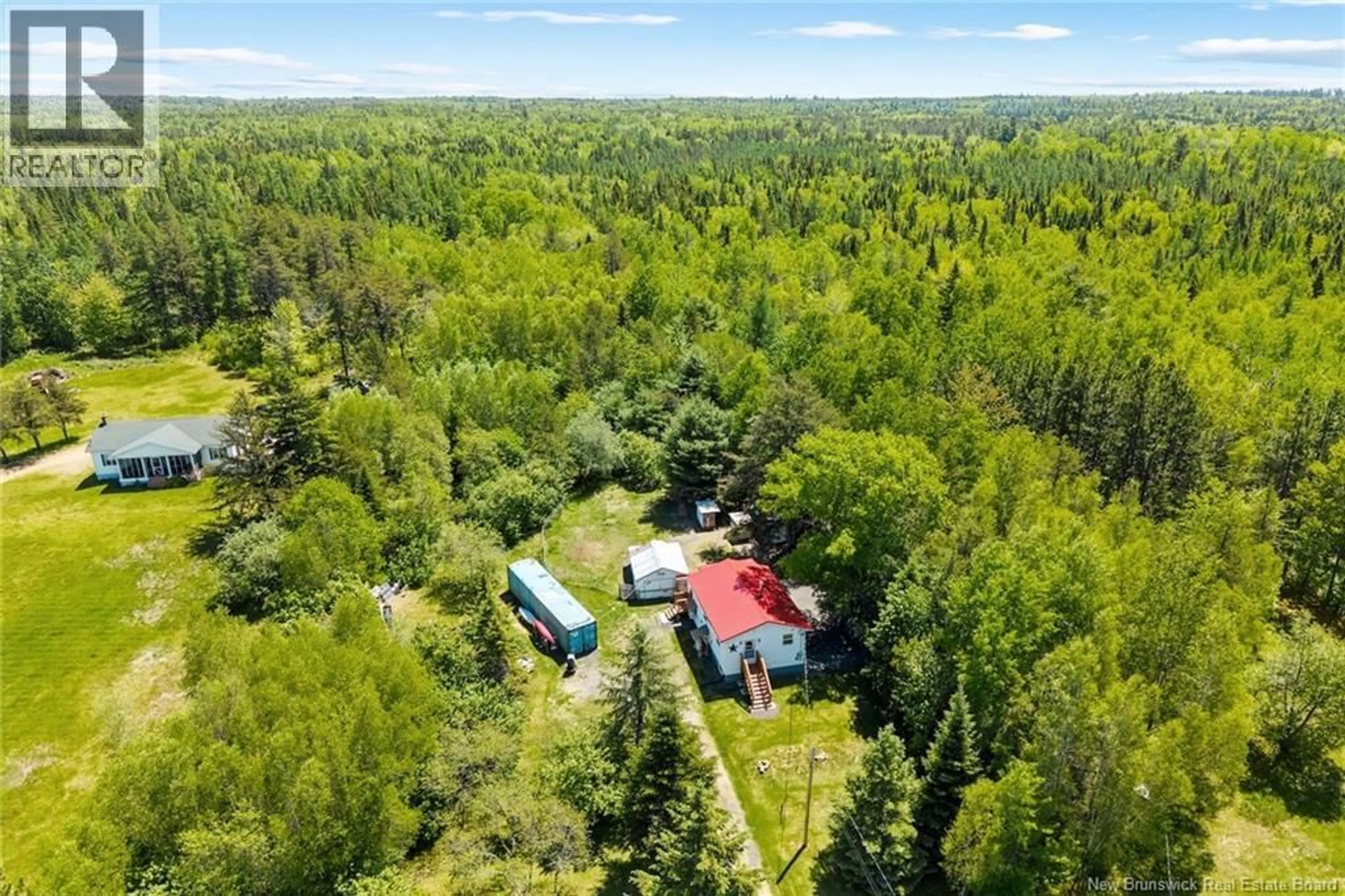 A pic from outside/outdoor area/front of a property/back of a property/a pic from drone, forest/trees view for 90 QUEEN STREET, Chipman New Brunswick E4A2K2