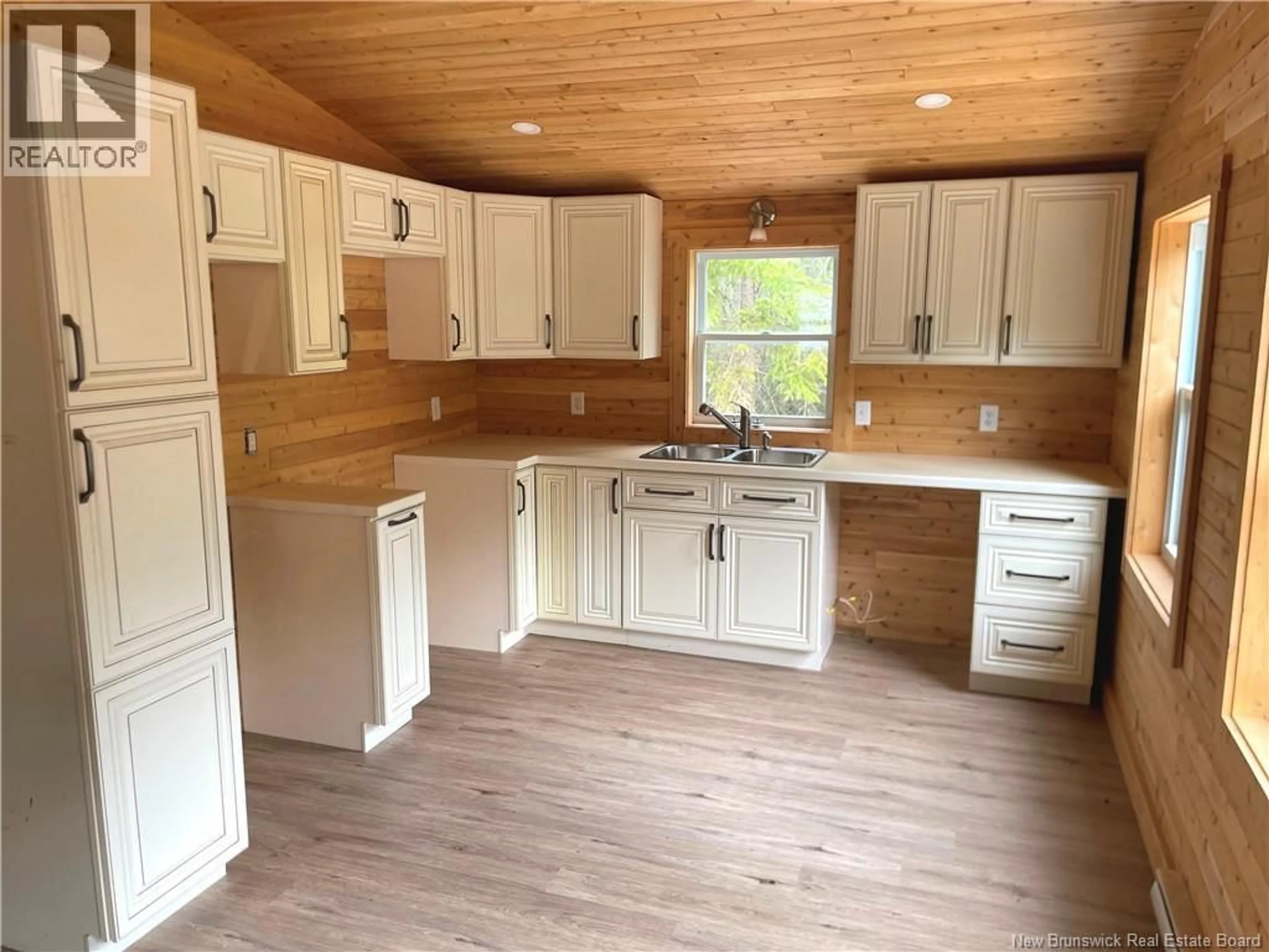 Open concept kitchen, wood/laminate floor for 20 TEED ROAD, Notre-Dame New Brunswick E4V2L9