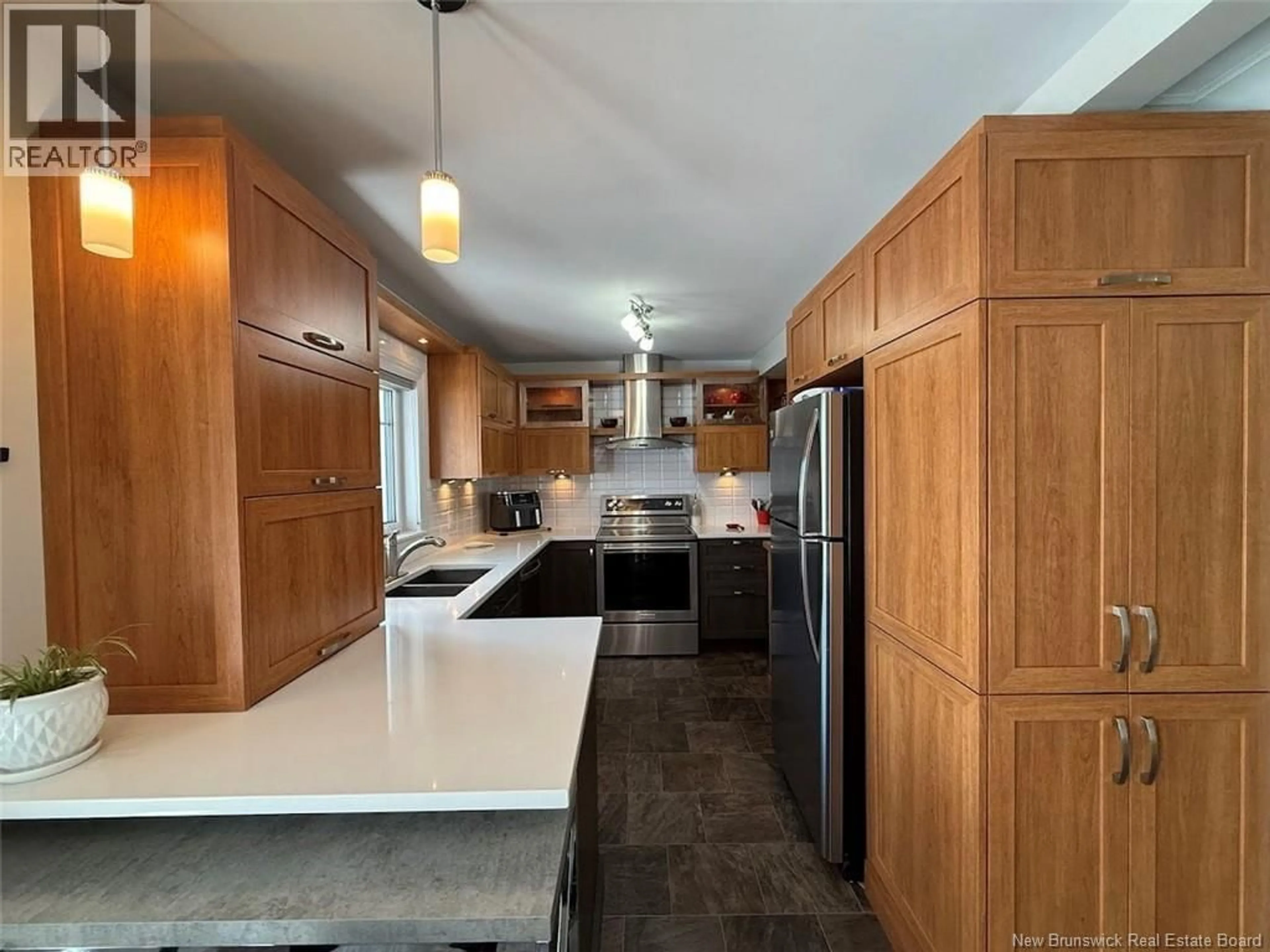 Open concept kitchen, ceramic/tile floor for 59 42E AVENUE, Edmundston New Brunswick E3V2Z4