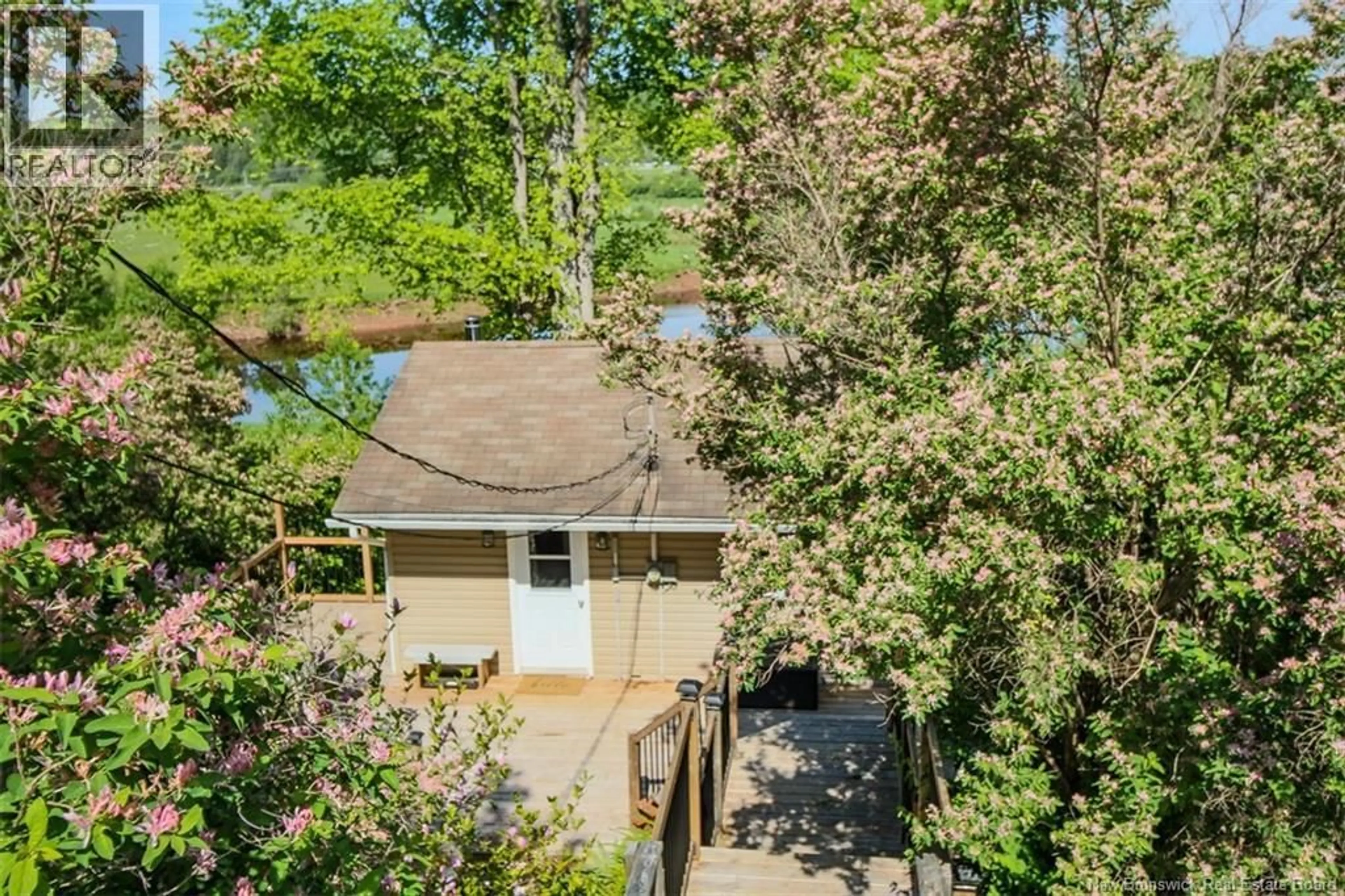 A pic from outside/outdoor area/front of a property/back of a property/a pic from drone, water/lake/river/ocean view for 82 PORTER ROAD, Nauwigewauk New Brunswick E5N6X2