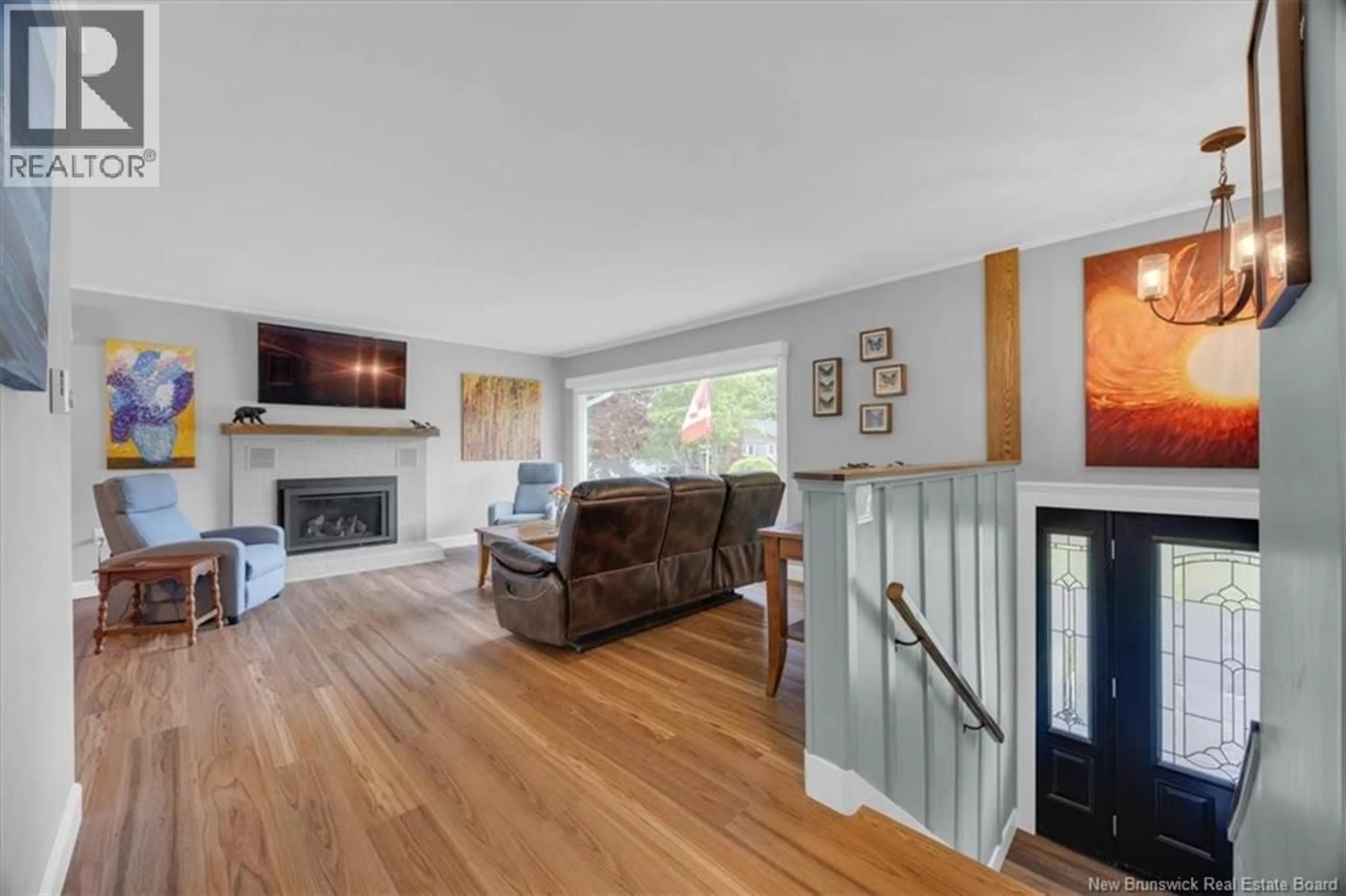 Living room with furniture, wood/laminate floor for 111 CHARLES STREET, Saint Andrews New Brunswick E5B2J4