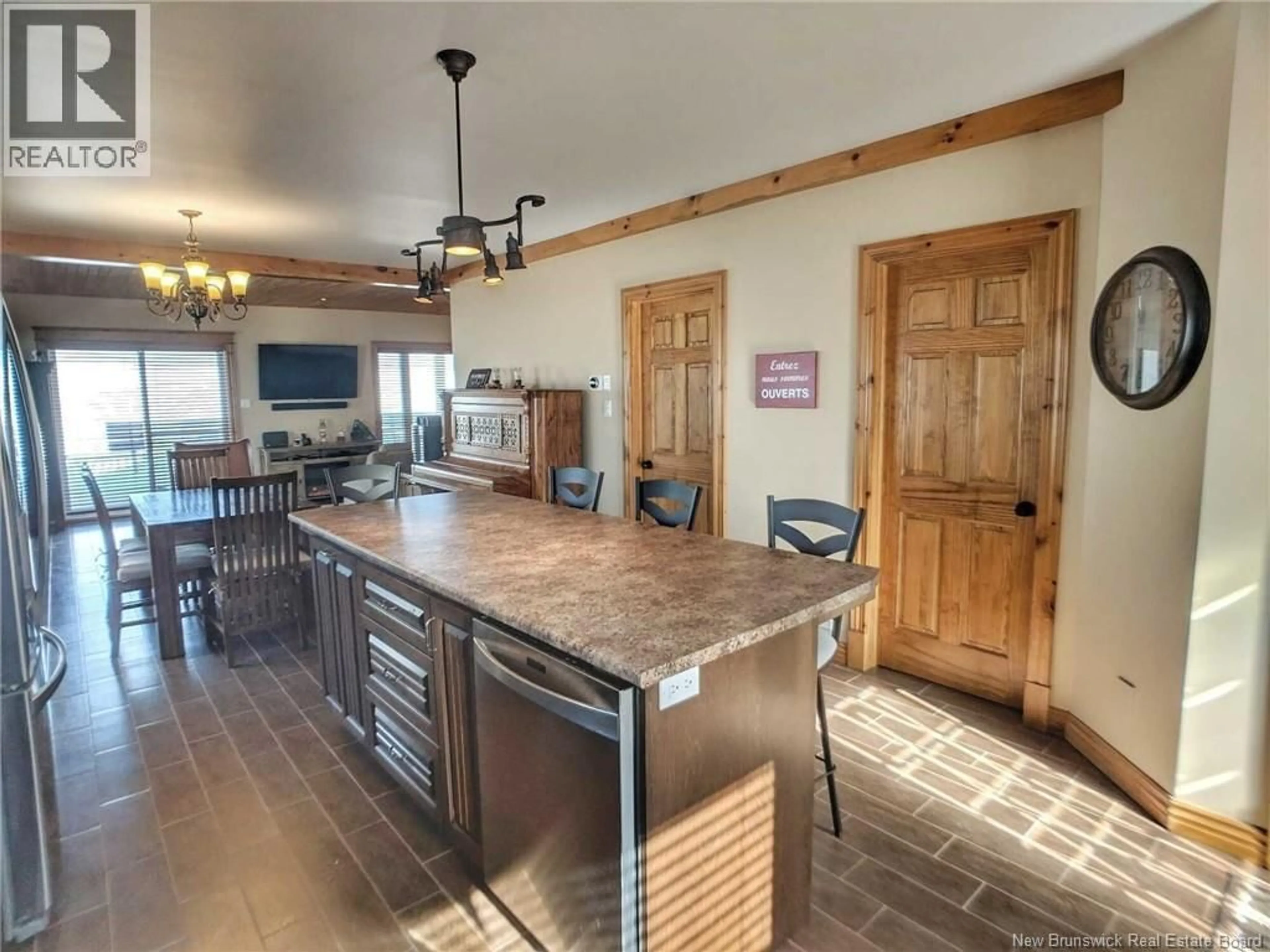 Open concept kitchen, ceramic/tile floor for 10 RUE DE LA DUNE, Caraquet New Brunswick E1W1B5