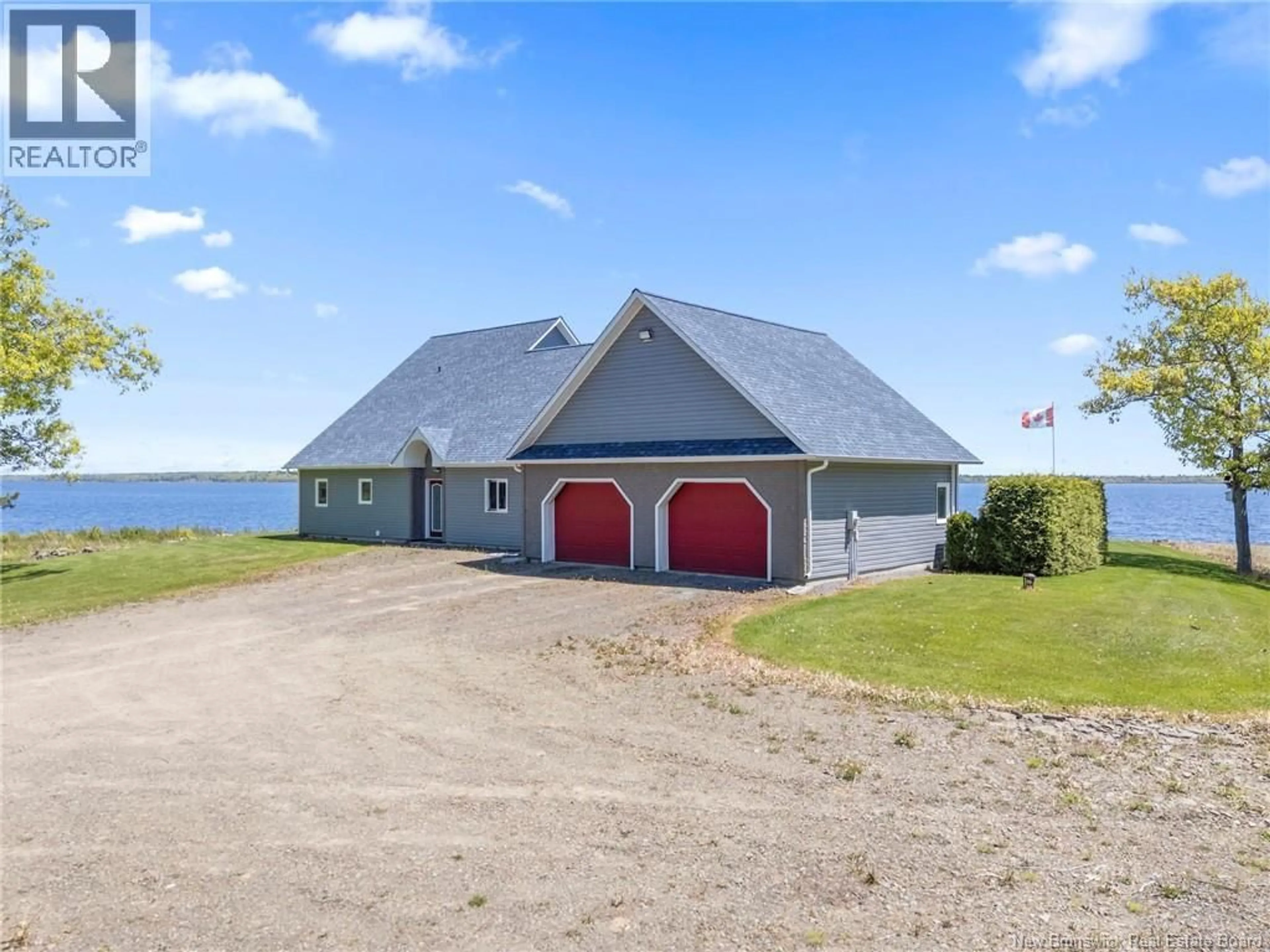 A pic from outside/outdoor area/front of a property/back of a property/a pic from drone, water/lake/river/ocean view for 124 WINTERPORT WAY, Grand Lake New Brunswick E4B4B1