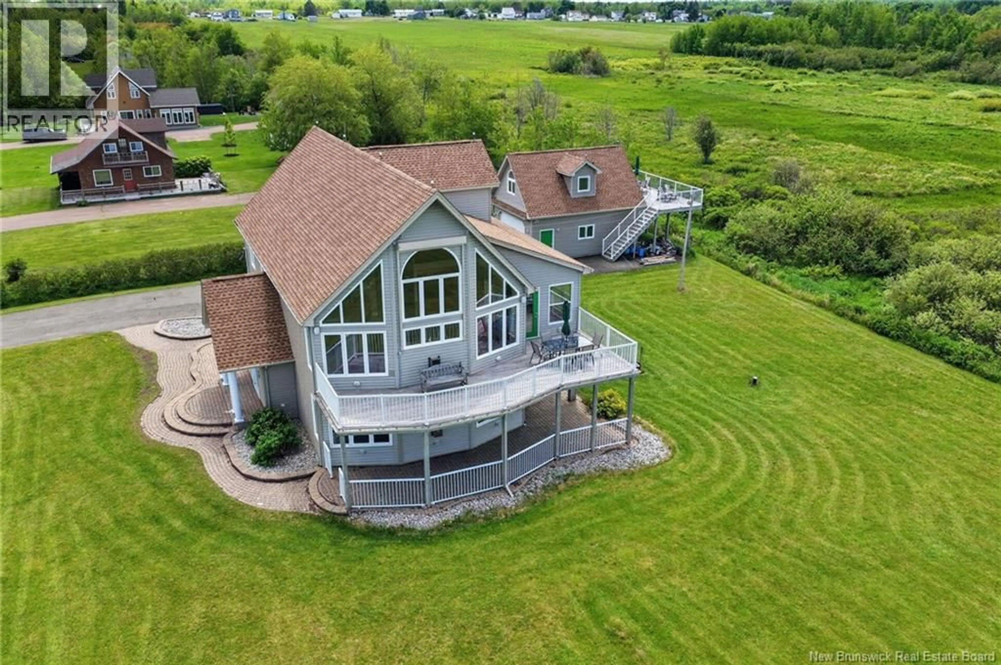 A pic from outside/outdoor area/front of a property/back of a property/a pic from drone, water/lake/river/ocean view for 128 BEAU RIVAGE DRIVE, Cap-Pelé New Brunswick E4N1M6