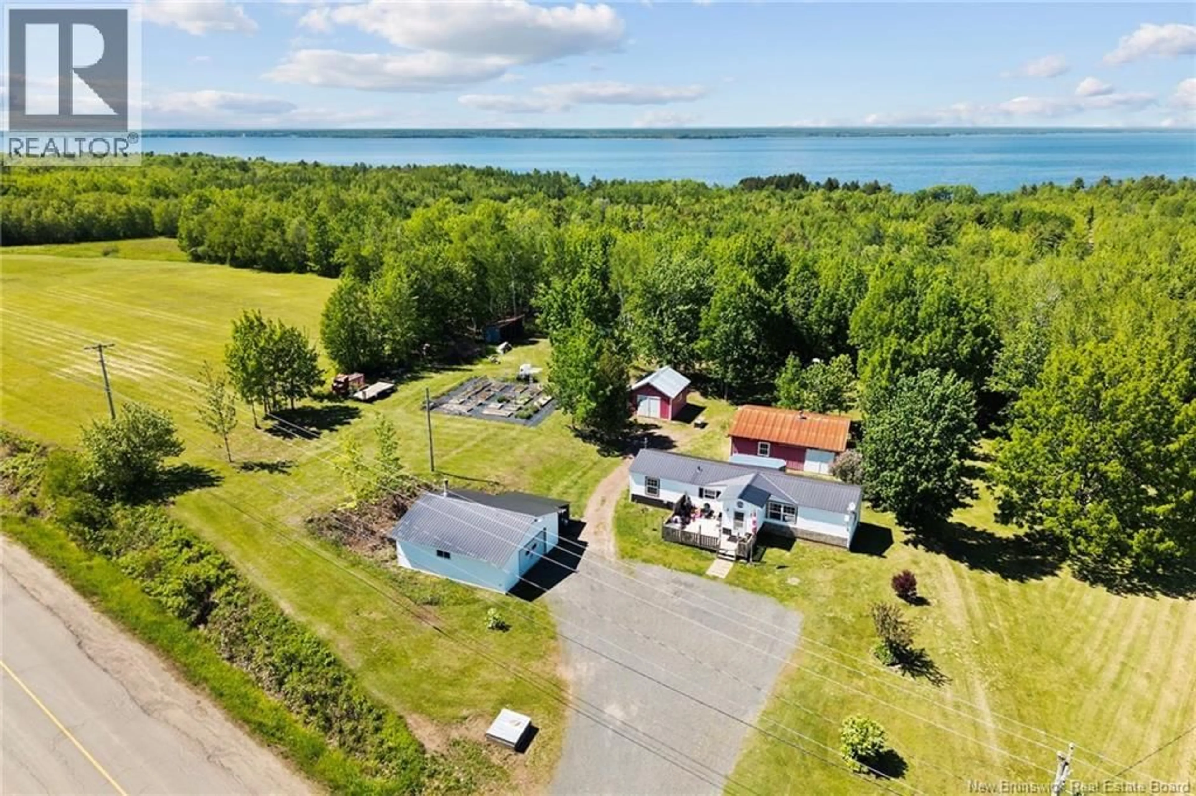 A pic from outside/outdoor area/front of a property/back of a property/a pic from drone, water/lake/river/ocean view for 5449 ROUTE 105, Whites Cove New Brunswick E4C3J1