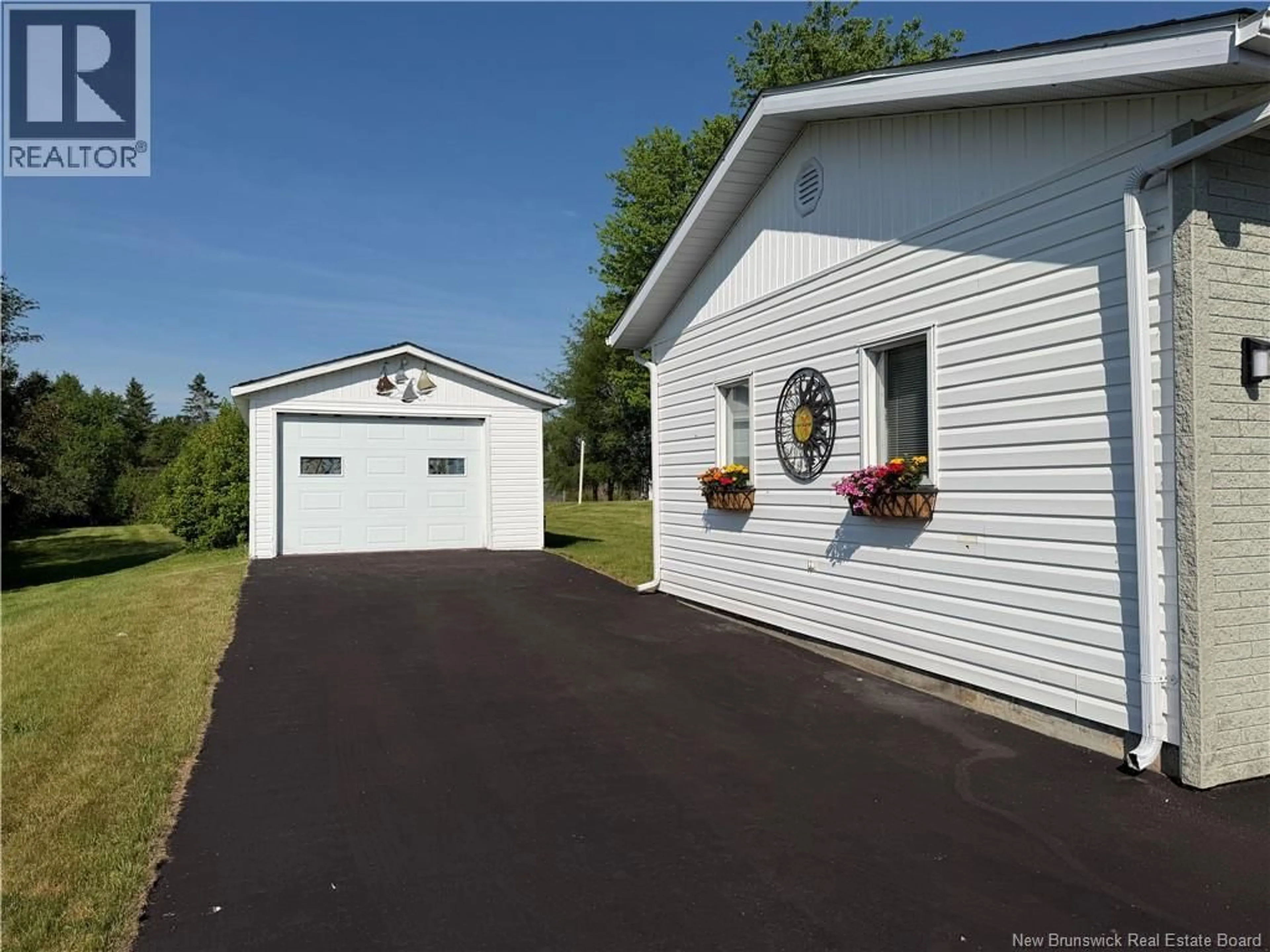 Home with vinyl exterior material, street for 28 FRONTIERE, Saint-François-de-Madawaska New Brunswick E7A1C7