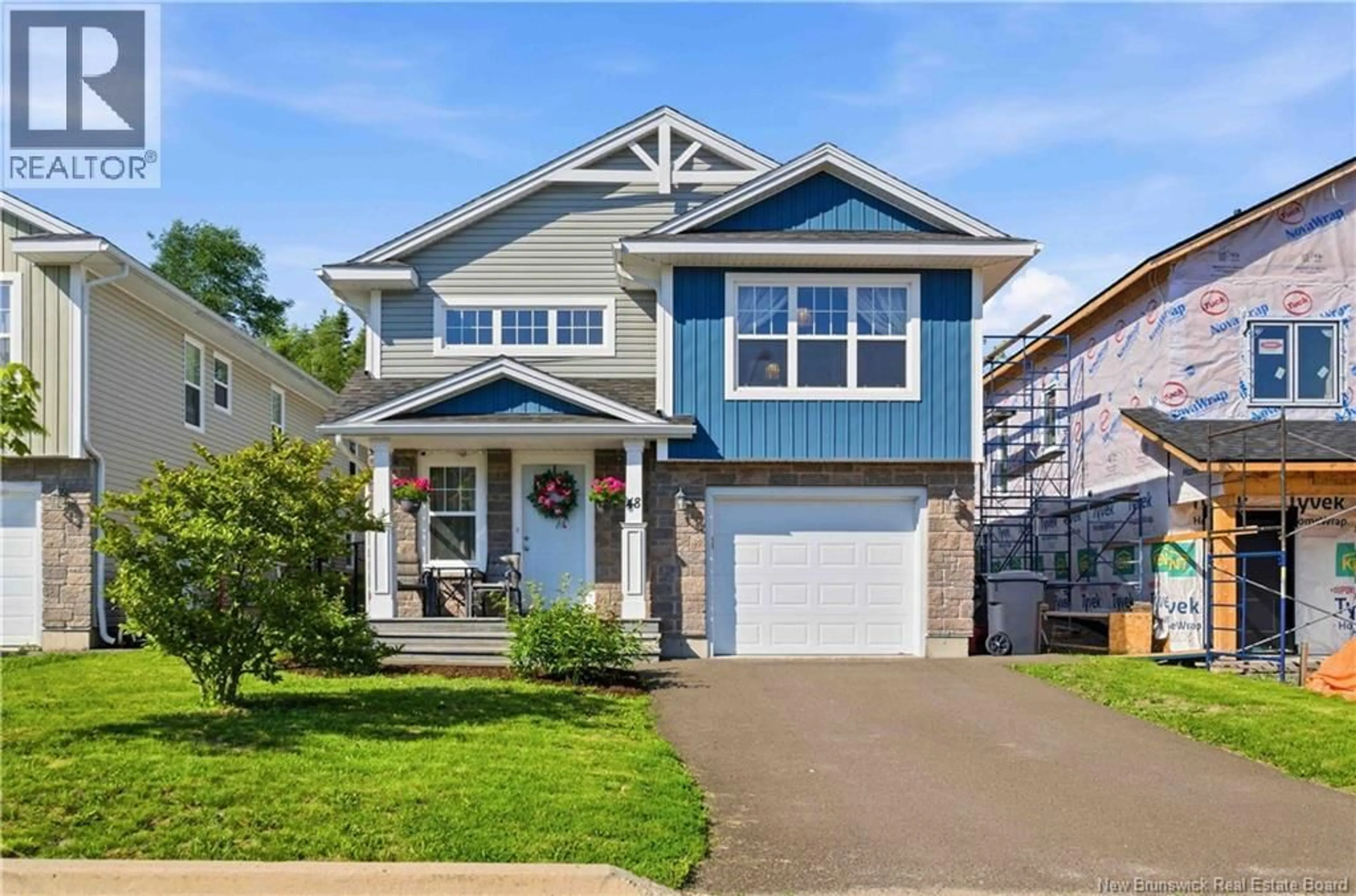 Home with vinyl exterior material, street for 48 WEAVERS WAY, Fredericton New Brunswick E3A3P8