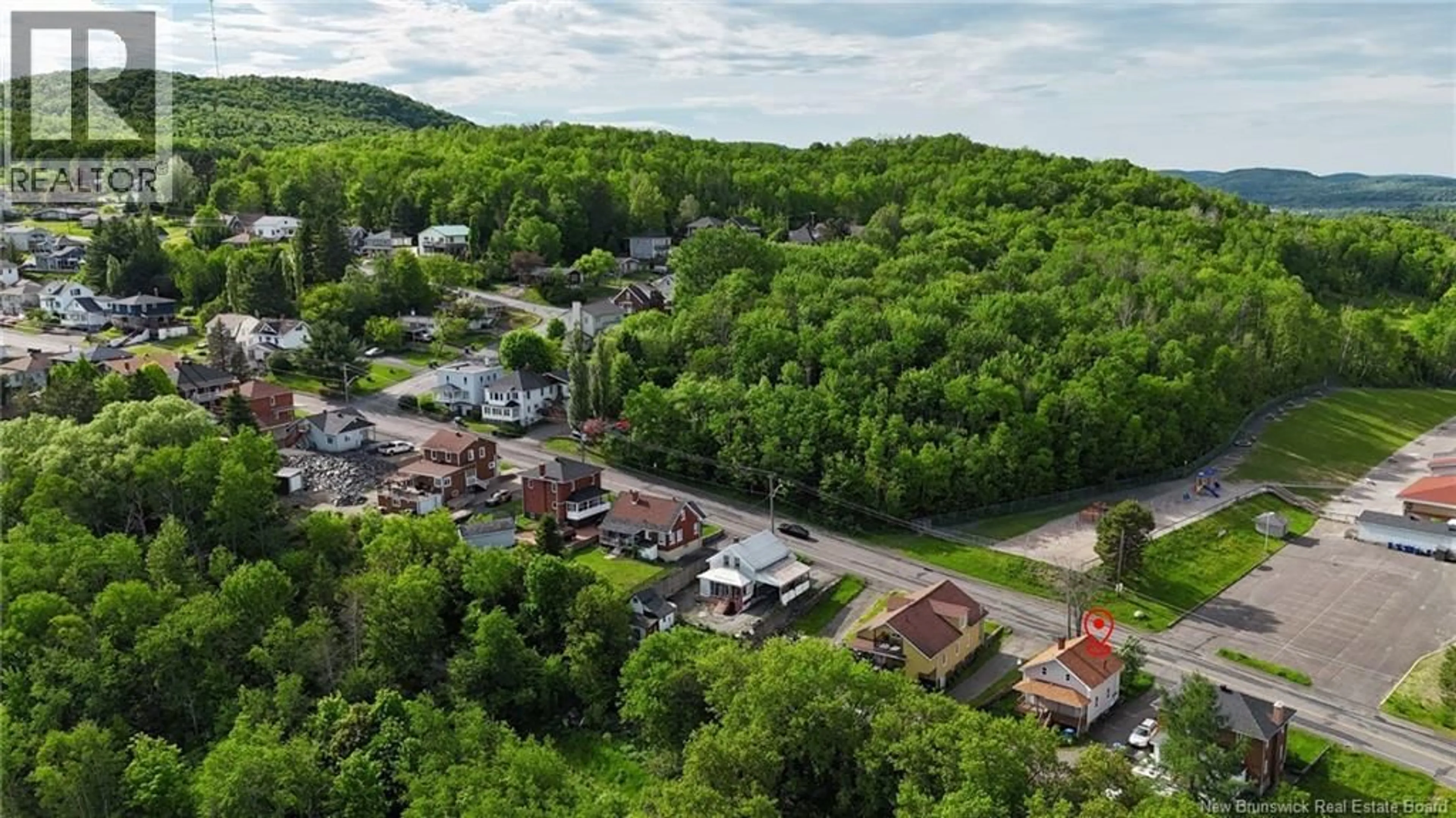 A pic from outside/outdoor area/front of a property/back of a property/a pic from drone, mountain view for 16 BELLEVUE STREET, Edmundston New Brunswick E3V2C7