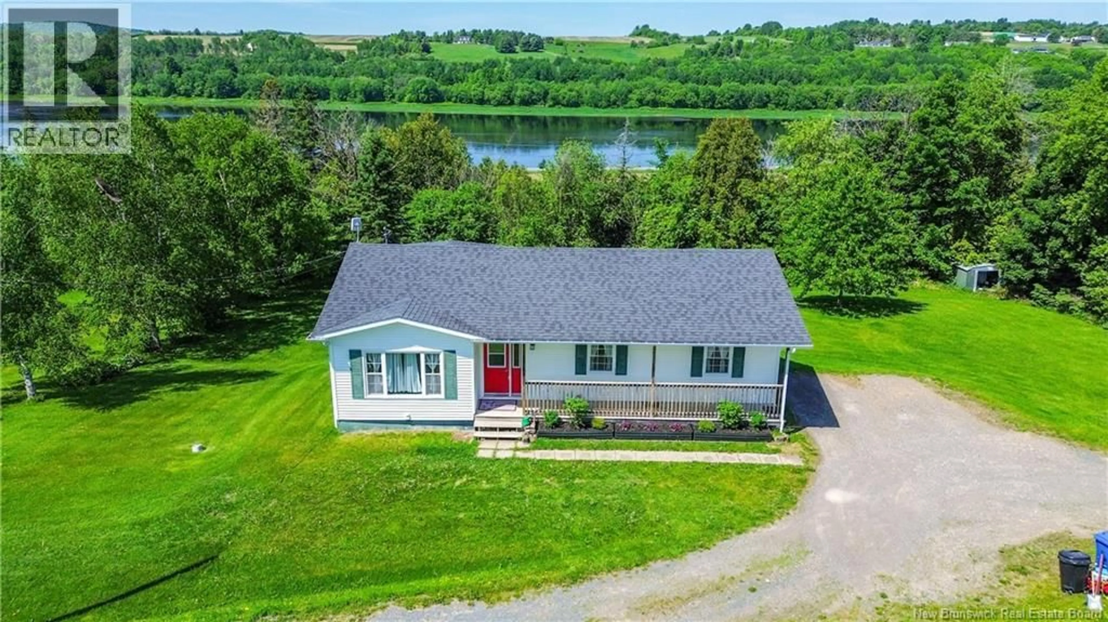 A pic from outside/outdoor area/front of a property/back of a property/a pic from drone, water/lake/river/ocean view for 80 WAUGH ROAD, Riverbank New Brunswick E7L4H6