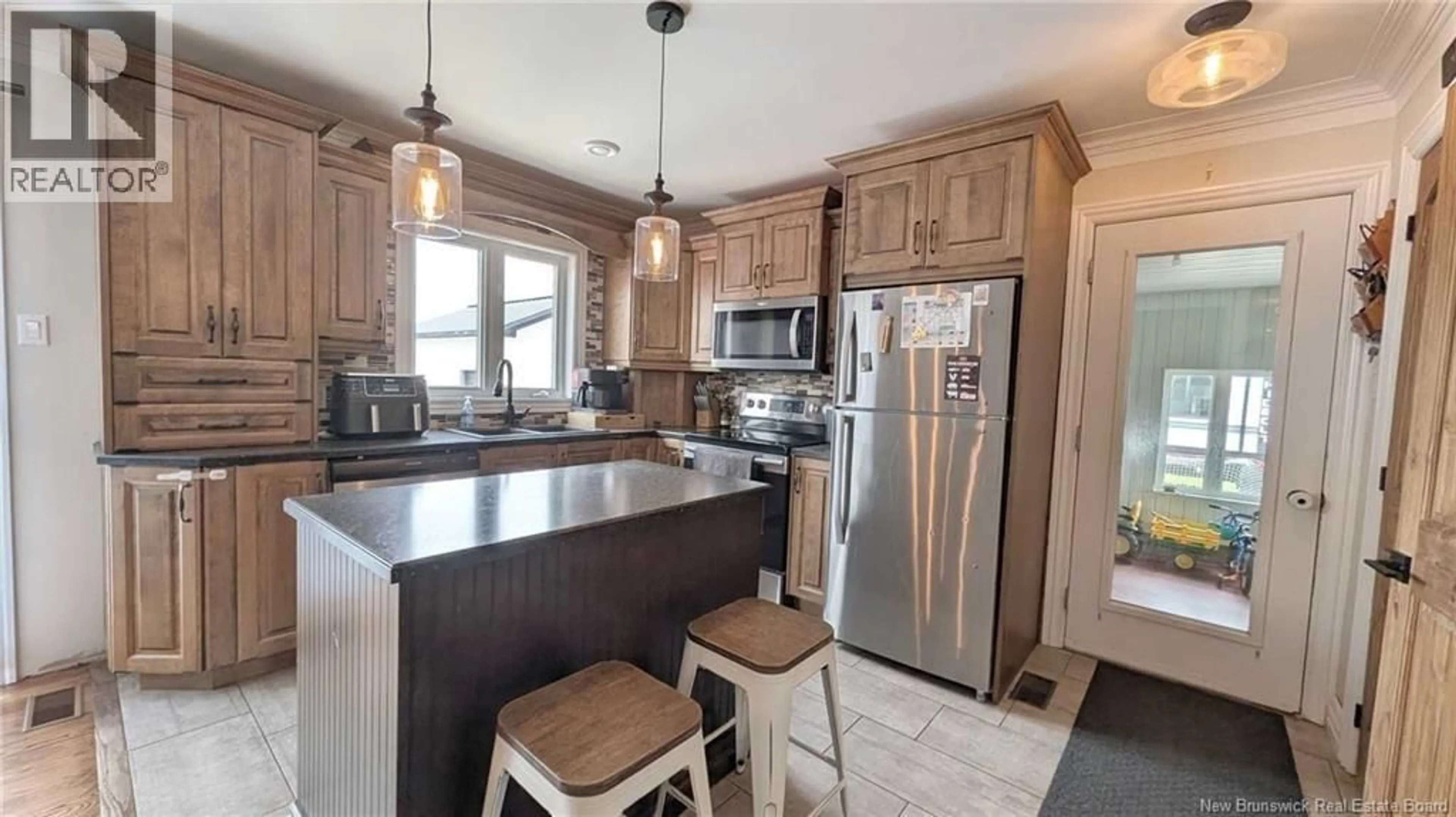 Open concept kitchen, ceramic/tile floor for 4325 BOULEVARD DES FONDATEURS BOULEVARD, Saint-Isidore New Brunswick E8M1G9