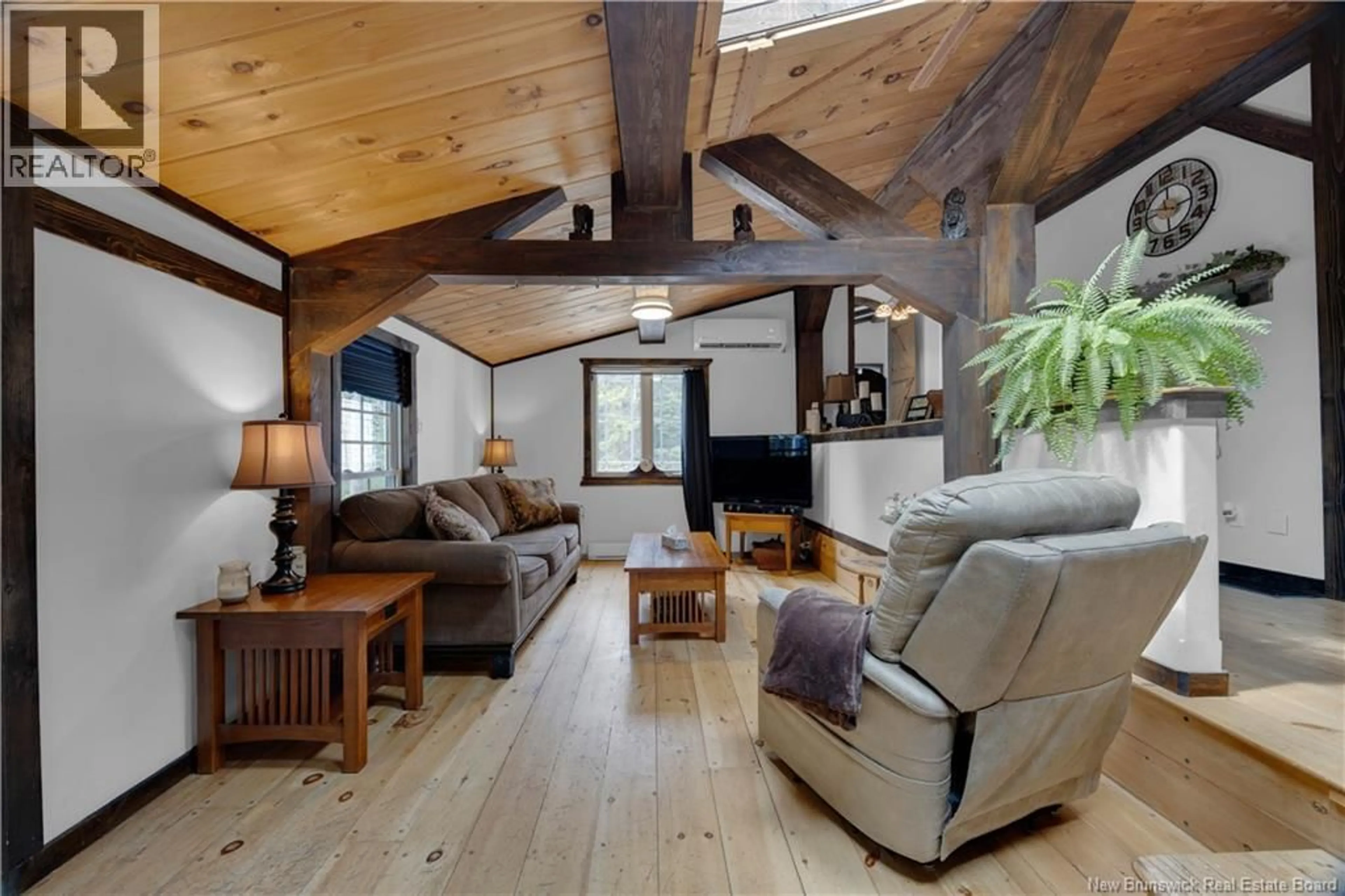 Living room with furniture, wood/laminate floor for 165 BASE ROAD, Willow Grove New Brunswick E2S1N4