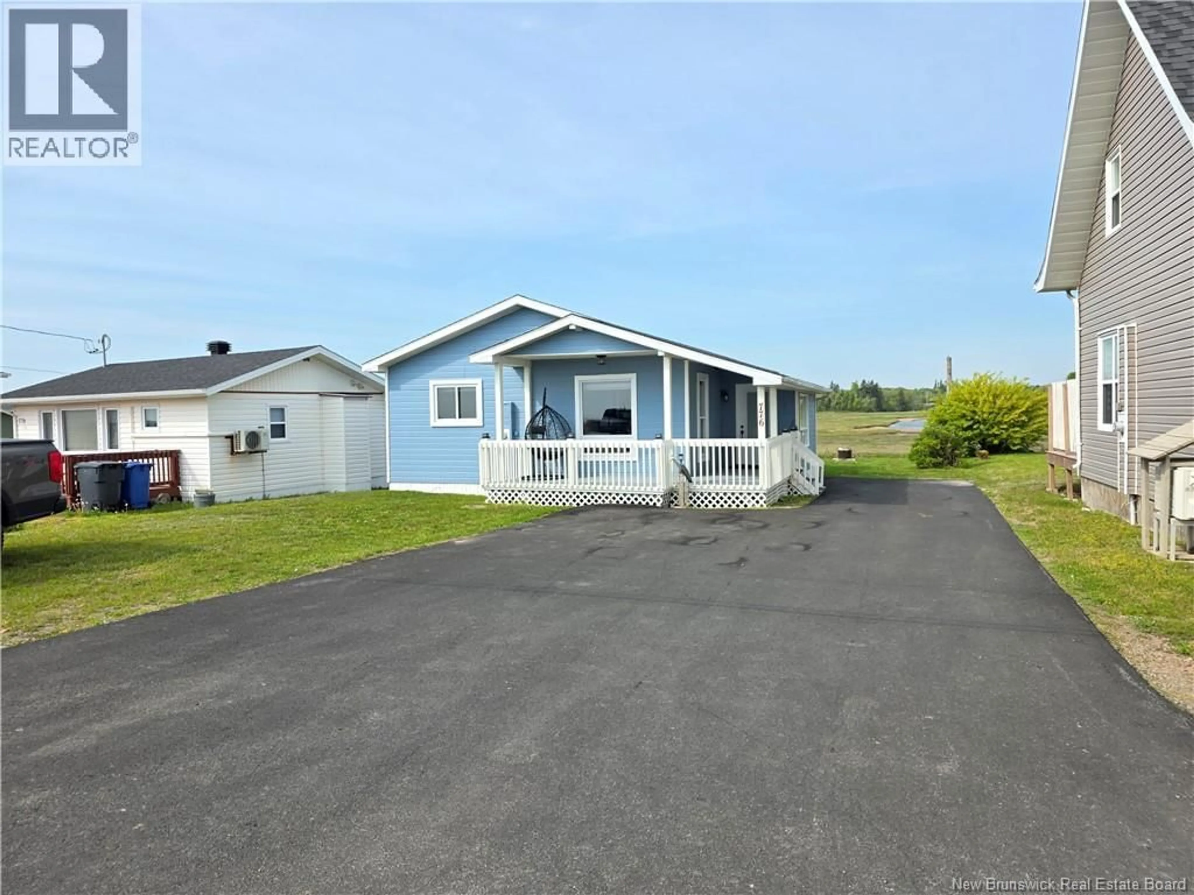 A pic from outside/outdoor area/front of a property/back of a property/a pic from drone, street for 776 JOHN CORMIER, Beresford New Brunswick E8K1W1