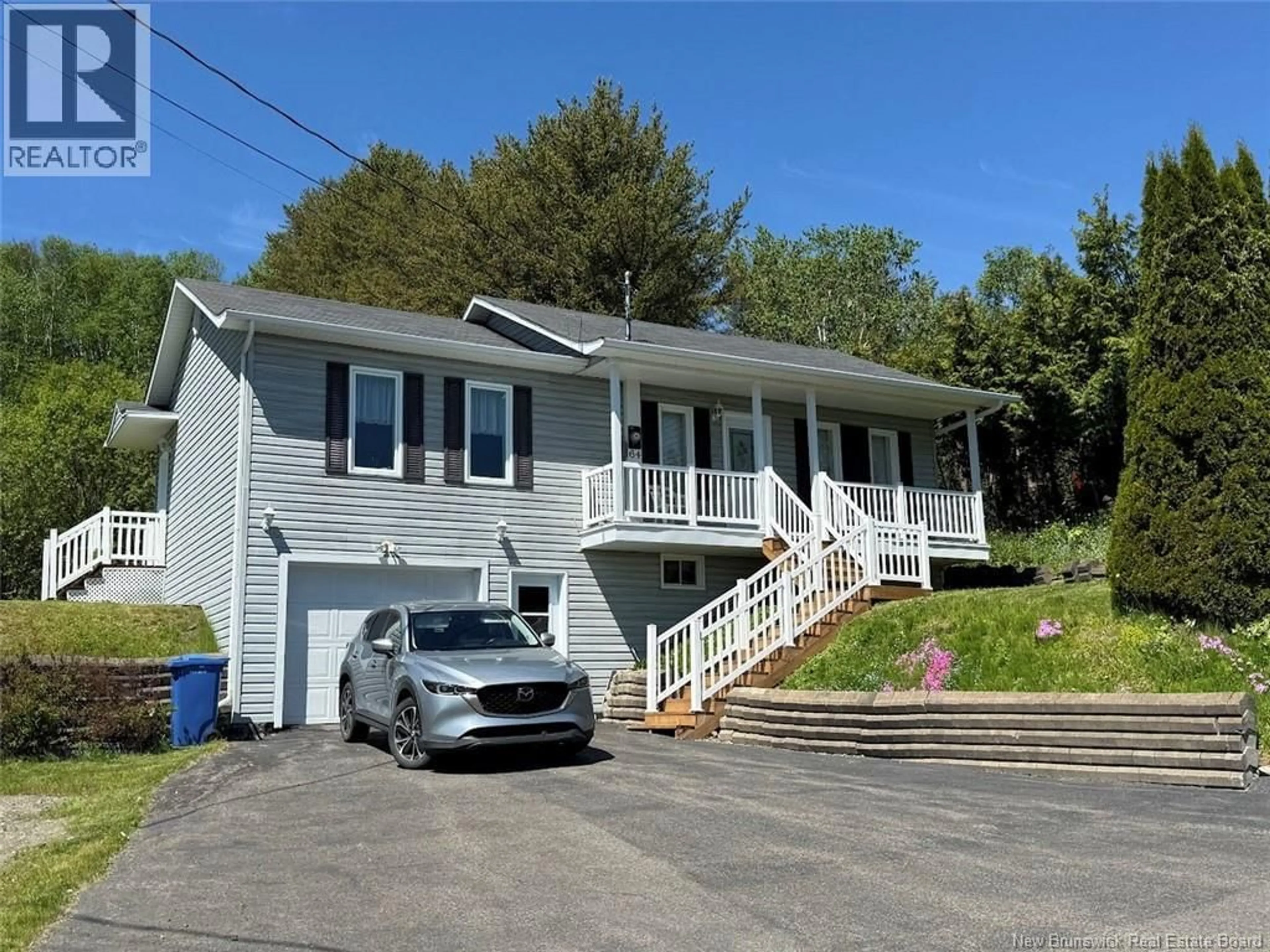 Home with vinyl exterior material, street for 64 ROSSIGNOL ROAD, Edmundston New Brunswick E3V3S3