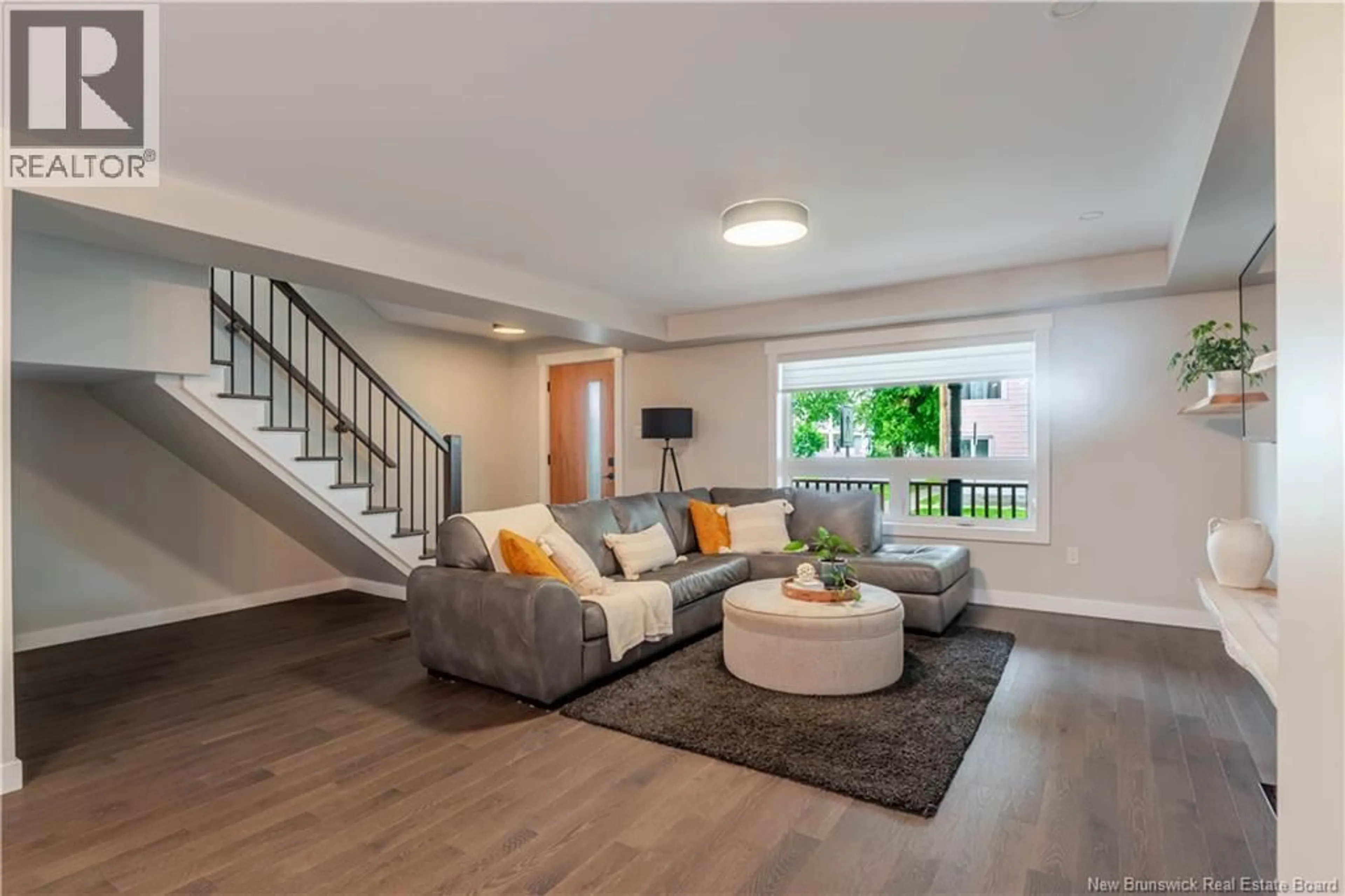 Living room with furniture, wood/laminate floor for 251 YORK STREET, Fredericton New Brunswick E3B3P2