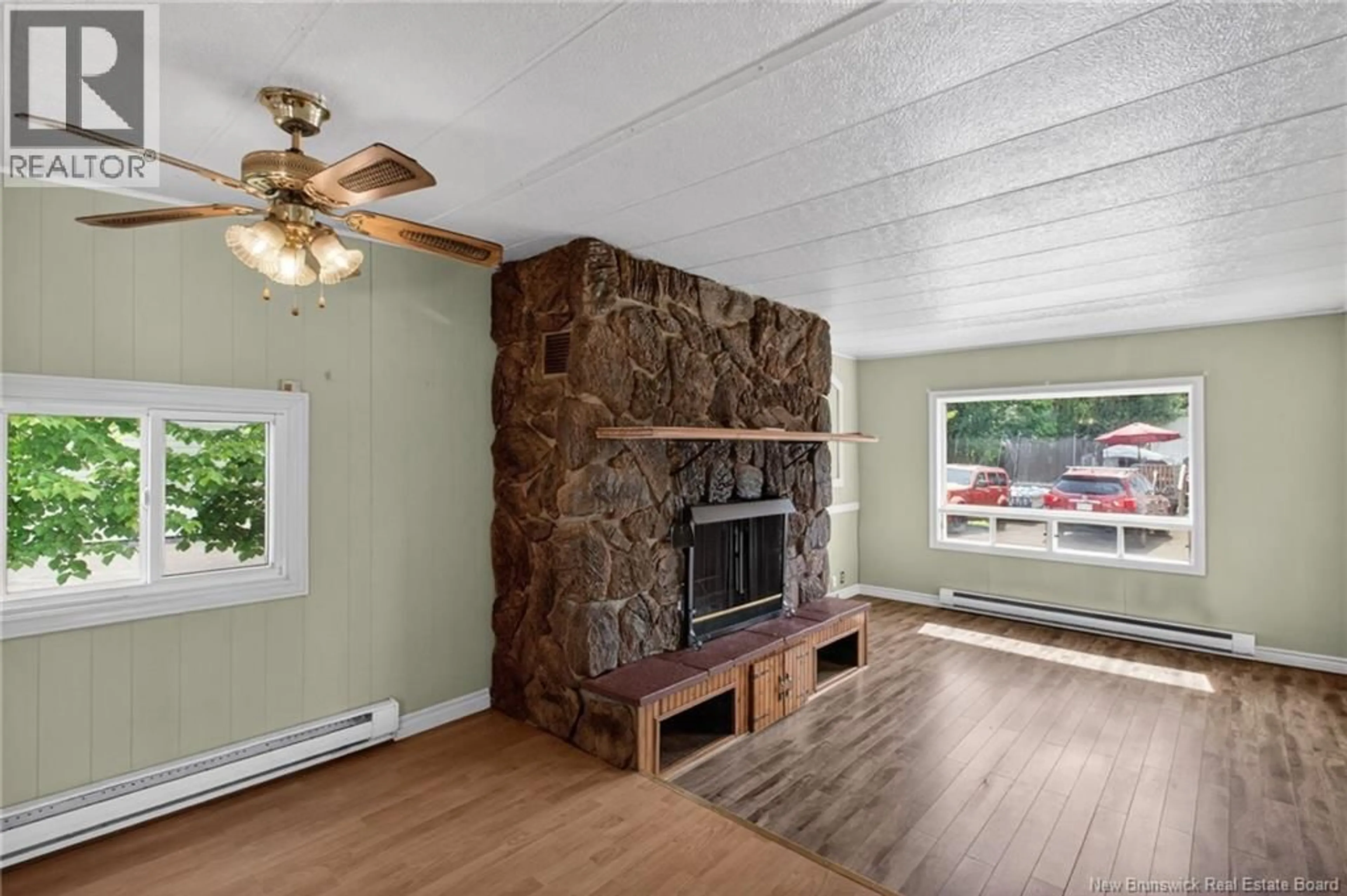 Living room with furniture, wood/laminate floor for 43 SHAMROCK AVENUE, Moncton New Brunswick E1E2J4
