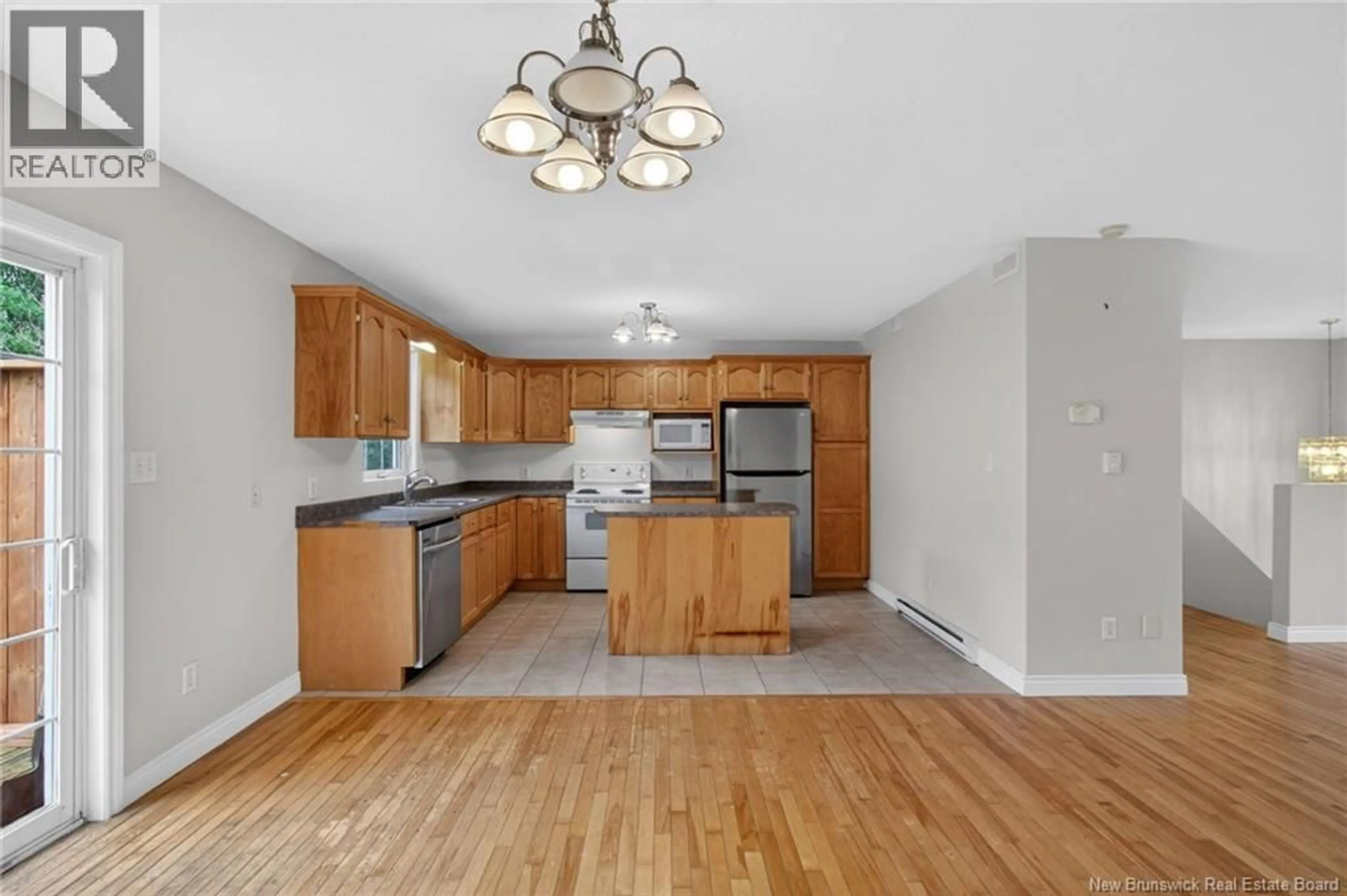 Open concept kitchen, wood/laminate floor for 75-77 HEMMER JANE, Moncton New Brunswick E1G2H4
